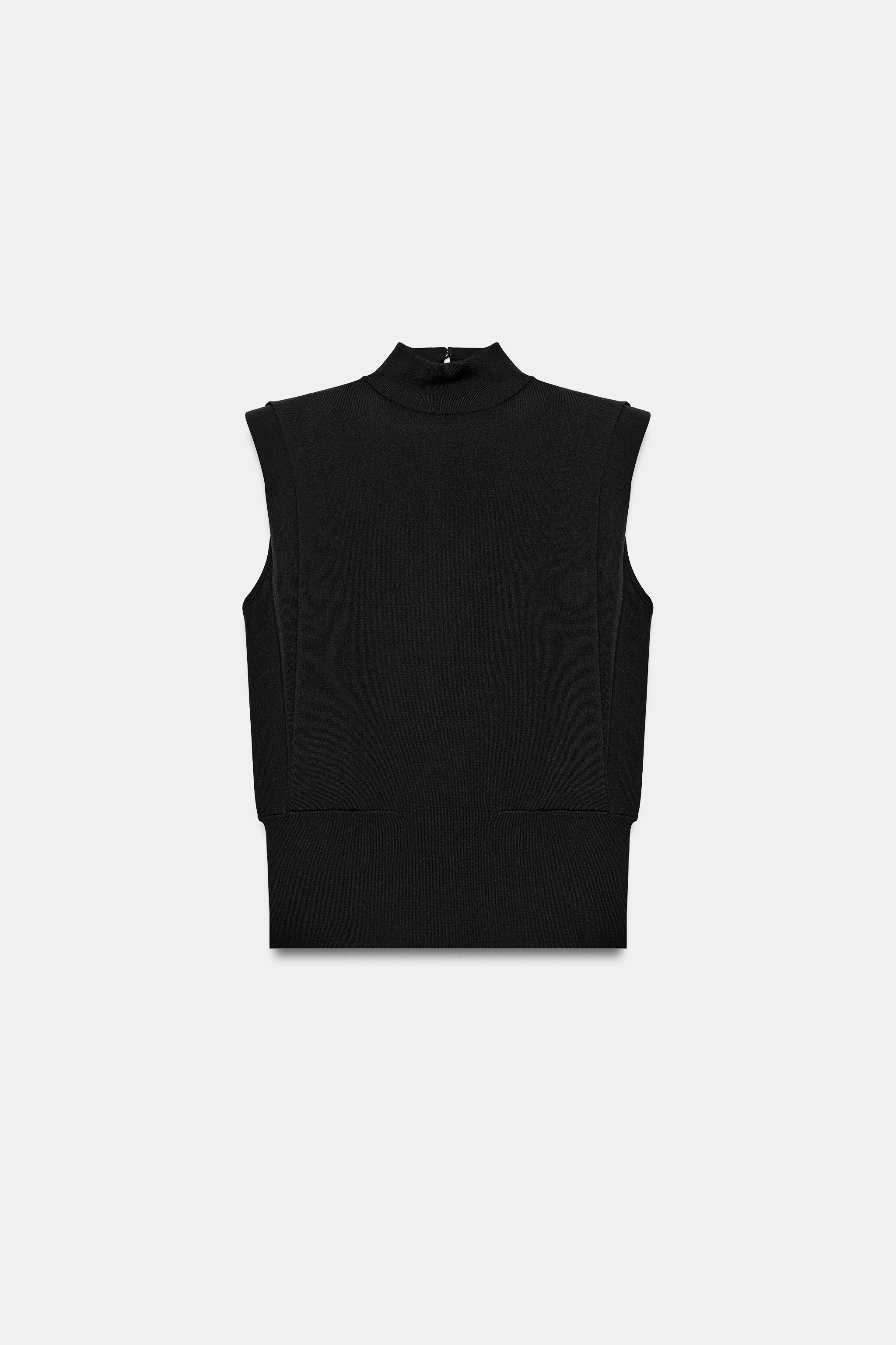 High collar sleeveless top with shoulder pads and pleats. Open back. Button closure at the back. | Zara US