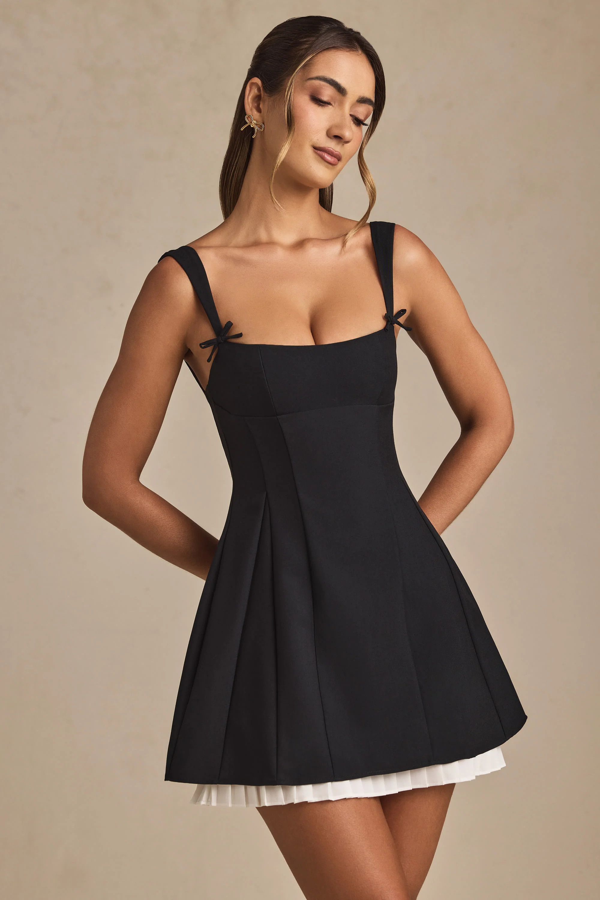Bow-Detail Pleated A-Line Mini Dress in Black | Oh Polly