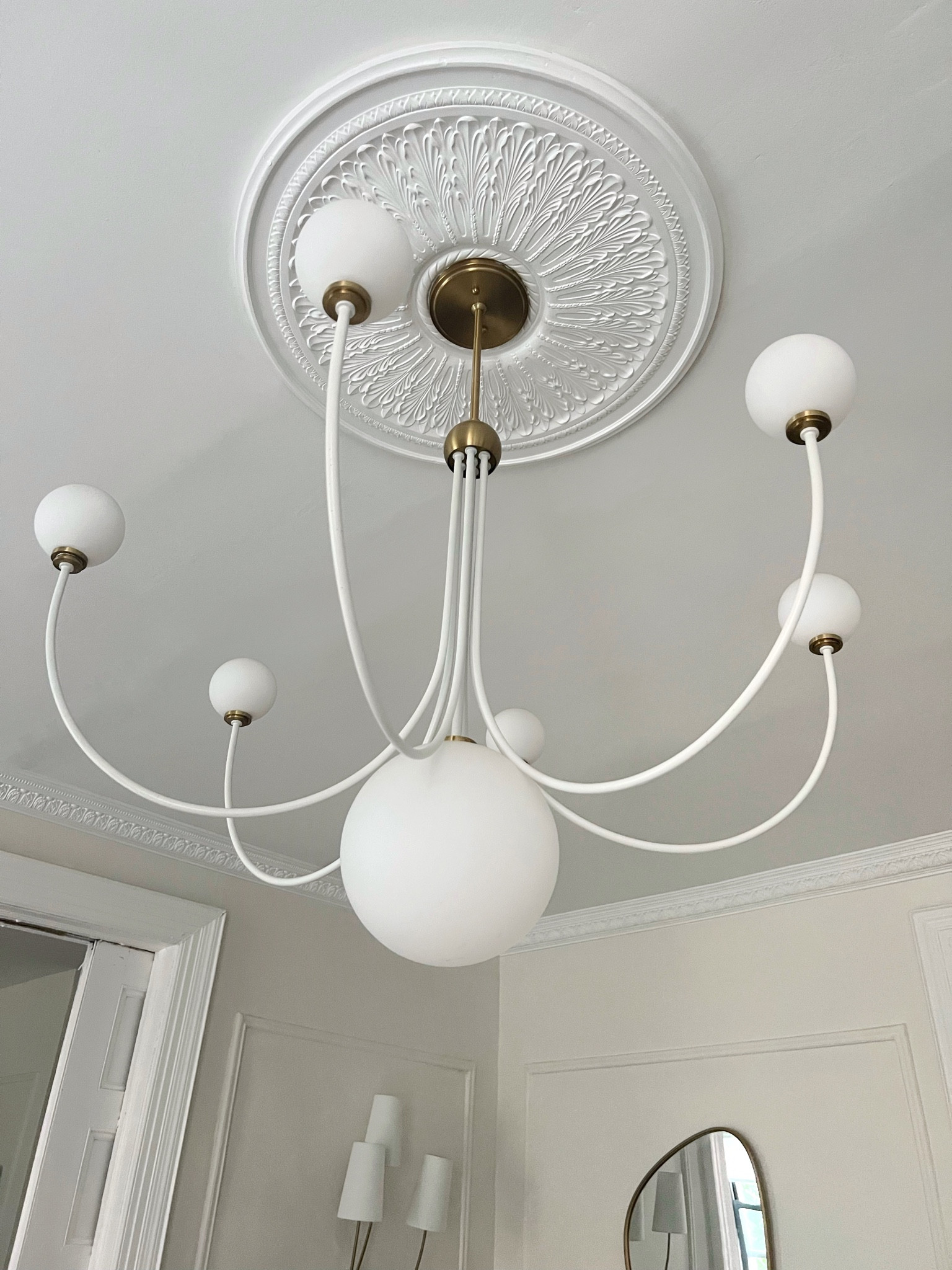 Crown molding, ceiling medallion, chandilier, sconce, assymetrical mirror 

#LTKhome #LTKstyletip #LTKFind