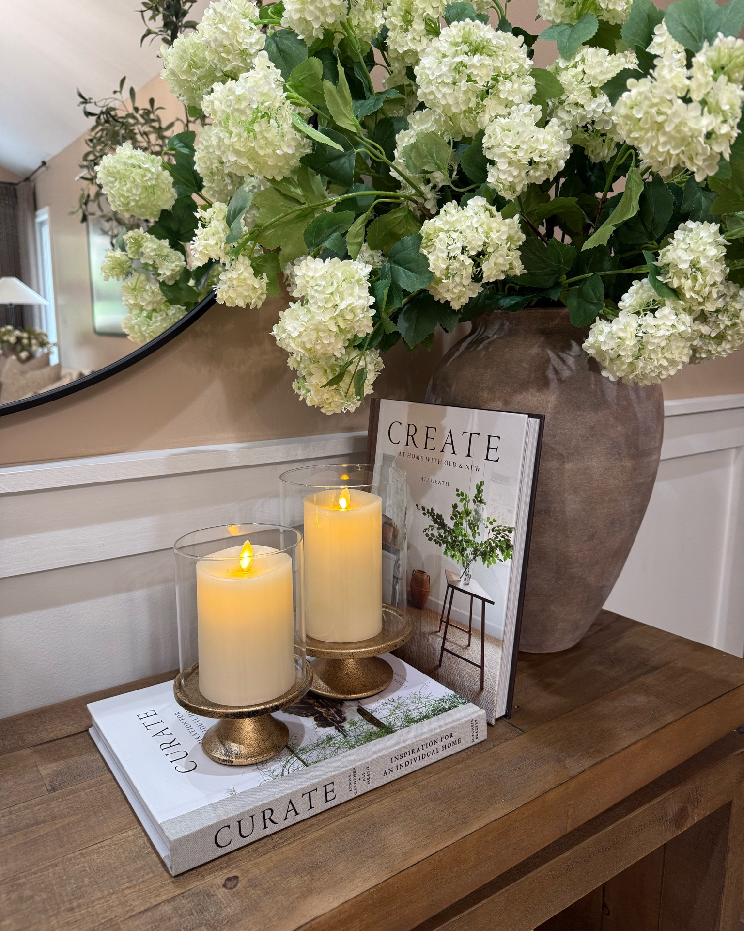 Console Table Refresh with Amazon Finds

Follow @farmtotablecreations on Instagram for more home styling ideas.

Gave my console table a fresh new look with several Amazon finds, including these gorgeous hydrangea stems, hurricane candle holders, and a beautiful ribbed decorative metal bowl. I used a total of 8 hydrangea stems in the vase for a fuller, more elevated look. Loving how these warm neutral pieces came together to create such a cozy and collected feel.

#consoletable #entrywaydecor #amazonhome #hydrangeas #hurricanecandleholders #decorativebowl #homedecor

#LTKSeasonal #LTKHome #LTKSaleAlert