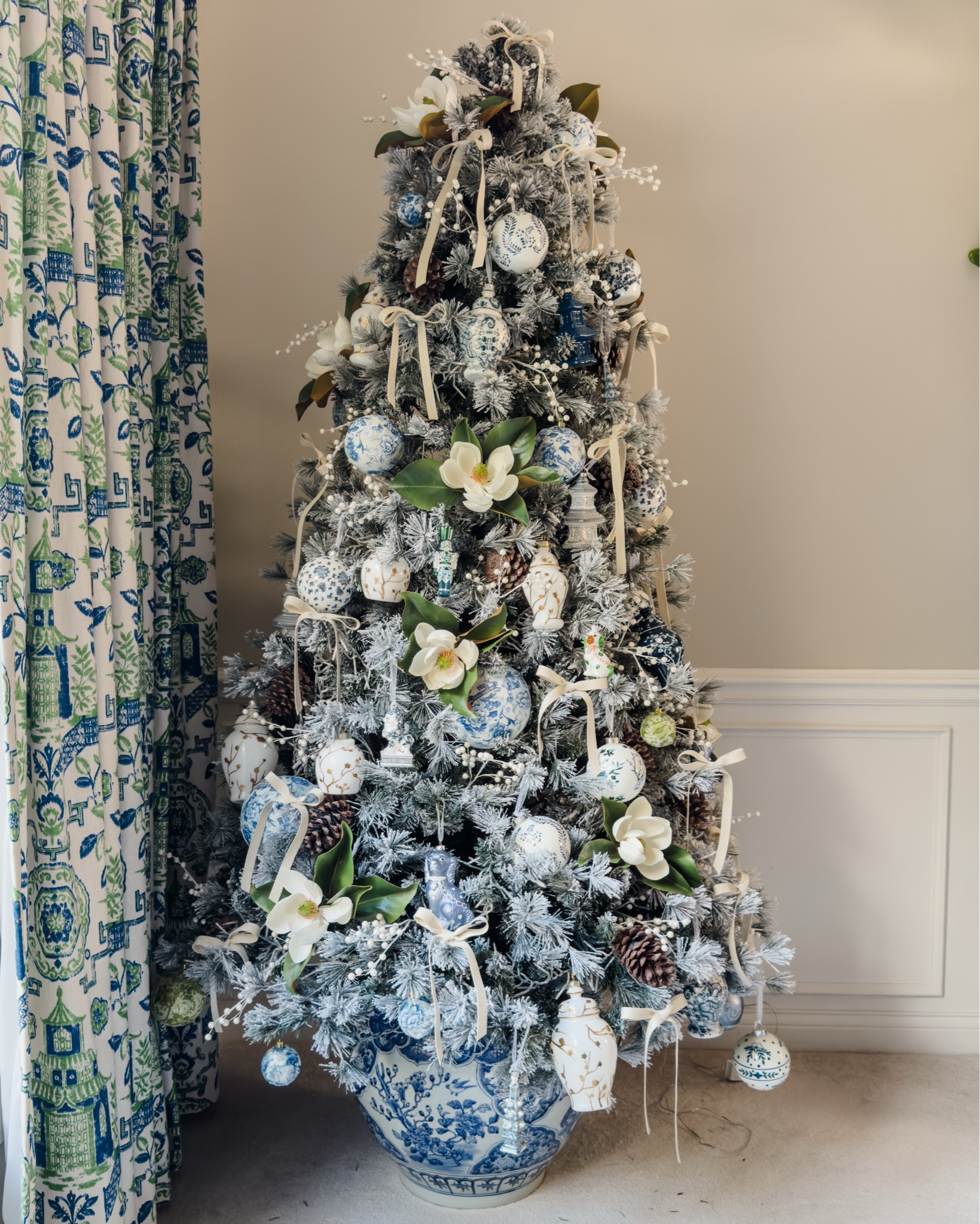 Blue and white chinoiserie / grandmillennial Christmas tree in a fishbowl porcelain planter. One of my favorite trees I do all year- changed it up a bit with velvet ribbon and the big planter as the base instead of a tree skirt  

#LTKHome #LTKSeasonal #LTKHoliday