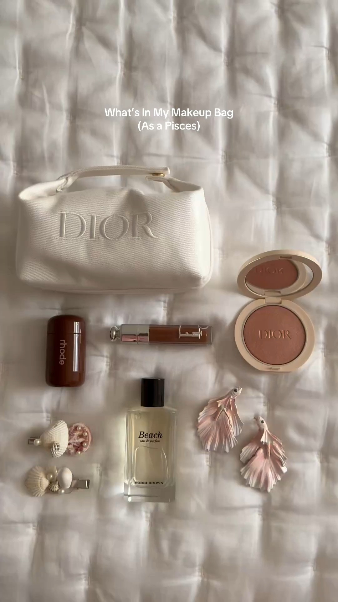 A Pisces and her trinkets 🐠 Love the #BobbiBrown Beach perfume which smells like sunscreen and salt, the #Rhode Bronzer for easy touch ups through the day, and the #Dior highlighter and bronzey lip gloss for easy summer makeup. #SummerBeauty #SummerMakeup

#LTKBeauty