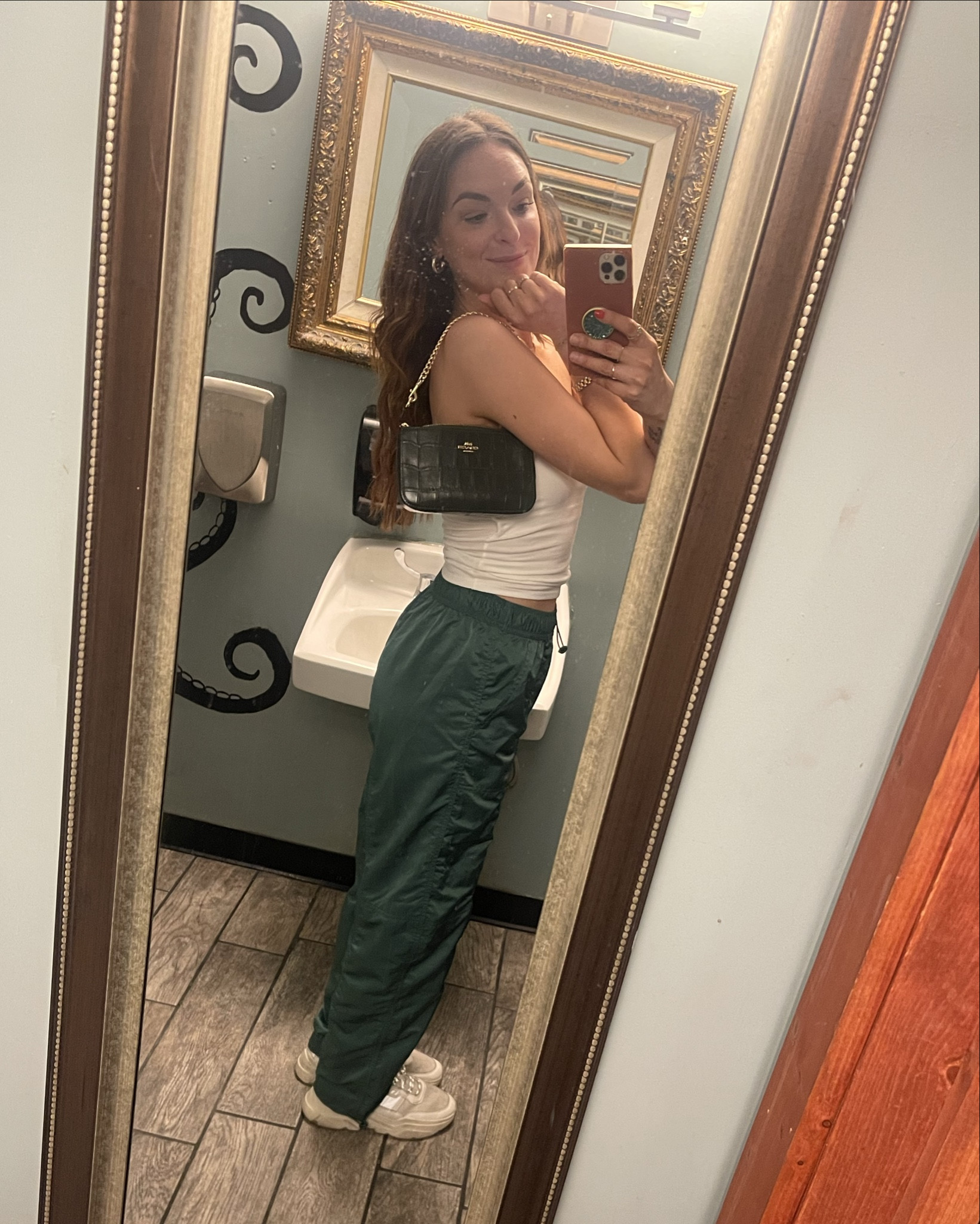 OOTN for bar hopping in St Pete, FL 🏝️
White bandeau with green track pants and sneakers with a cutie little Coach purse! 

#LTKStyleTip #LTKFindsUnder100 #LTKFindsUnder50