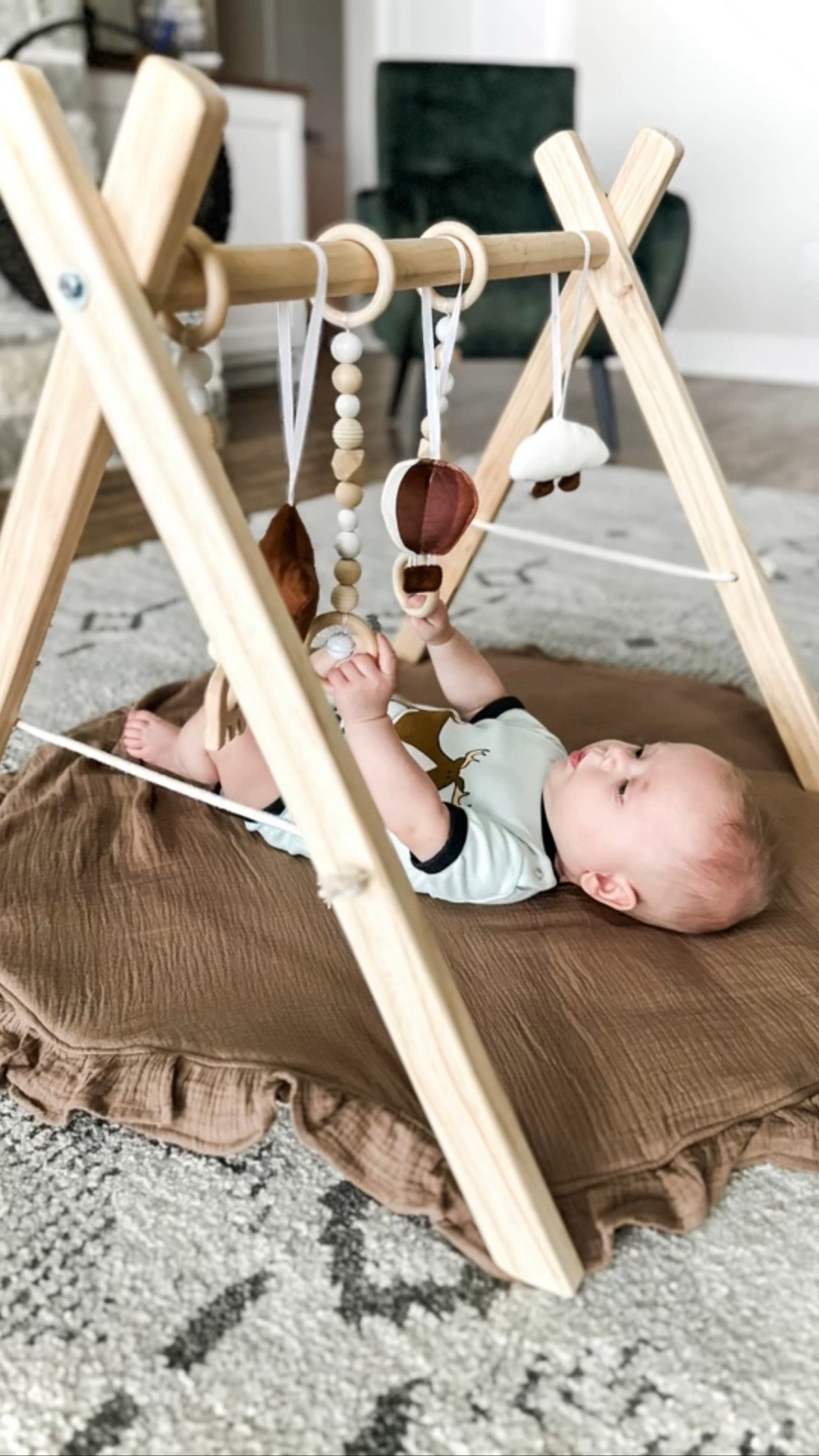 We have been loving this brown wooden baby play gym and mat. It keeps little man entertained and his little personality comes alive when he is playing on it. Great place for him to explore and practice rolling over. It  easy to assemble, machine washable, and I love that you can easily fold it and store away when not in use. 


#LTKfamily #LTKbaby #LTKMostLoved