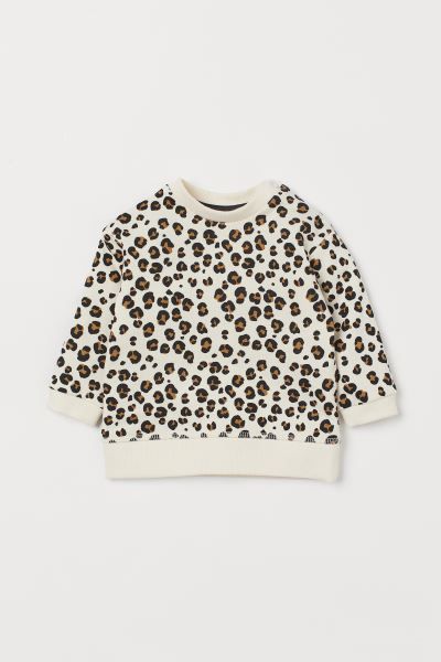 Lightweight cotton sweatshirt. Long sleeves, gently dropped shoulders with snap fasteners at one ... | H&M (US + CA)