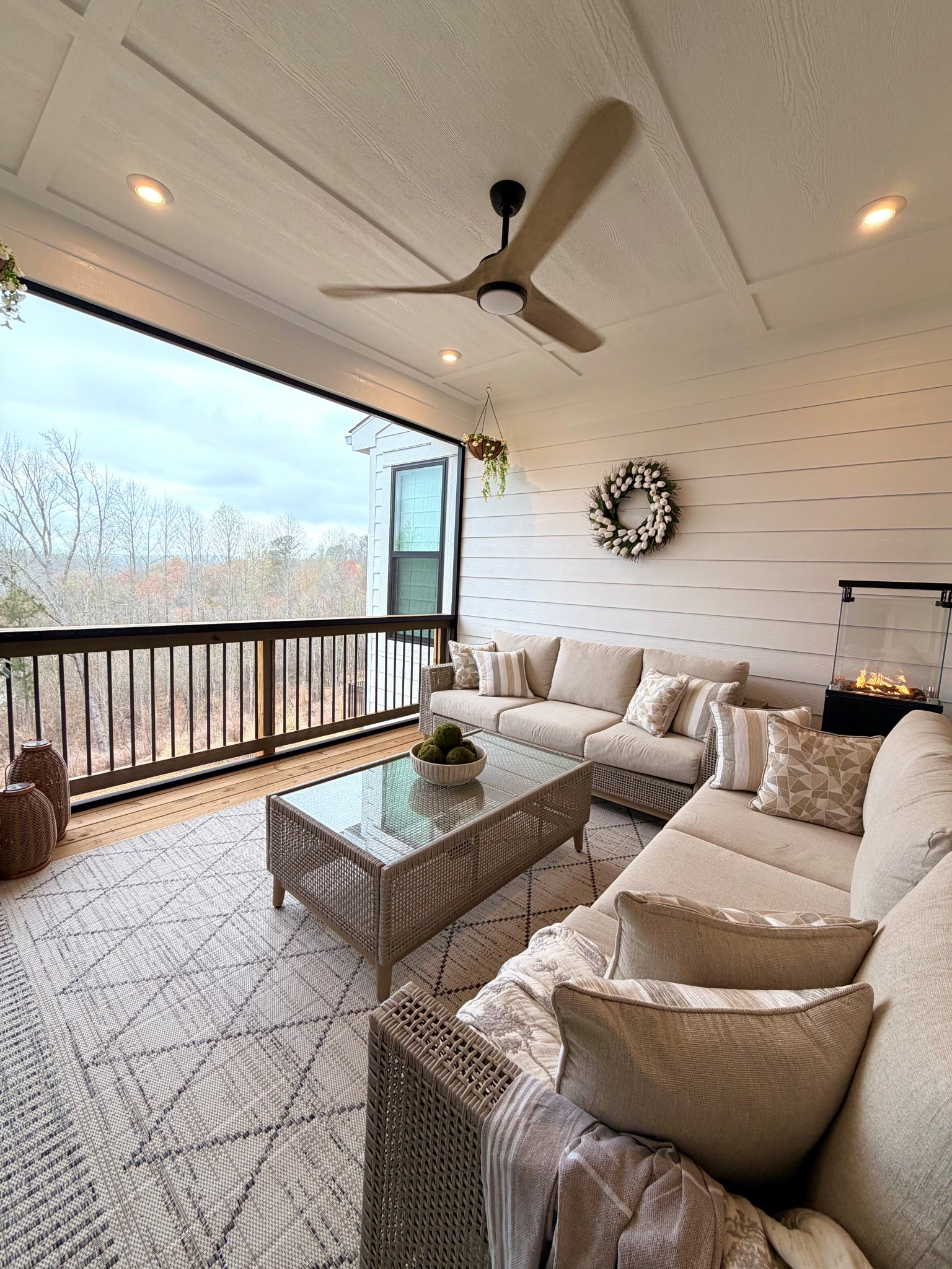 This porch has quickly become one of our favorite places to unwind. 🤍 I wanted the space to feel cozy, layered, and inviting while still keeping everything light and neutral so the view could really shine.

The neutral outdoor sectional, textured rug, and woven coffee table create the perfect little lounge moment for morning coffee or slow evenings by the fire. I added soft patterned pillows and simple greenery to keep it relaxed but still styled.

It’s proof that a few thoughtful pieces can completely transform an outdoor space into an extension of your home.

#LTKHome #LTKSeasonal #LTKOver40