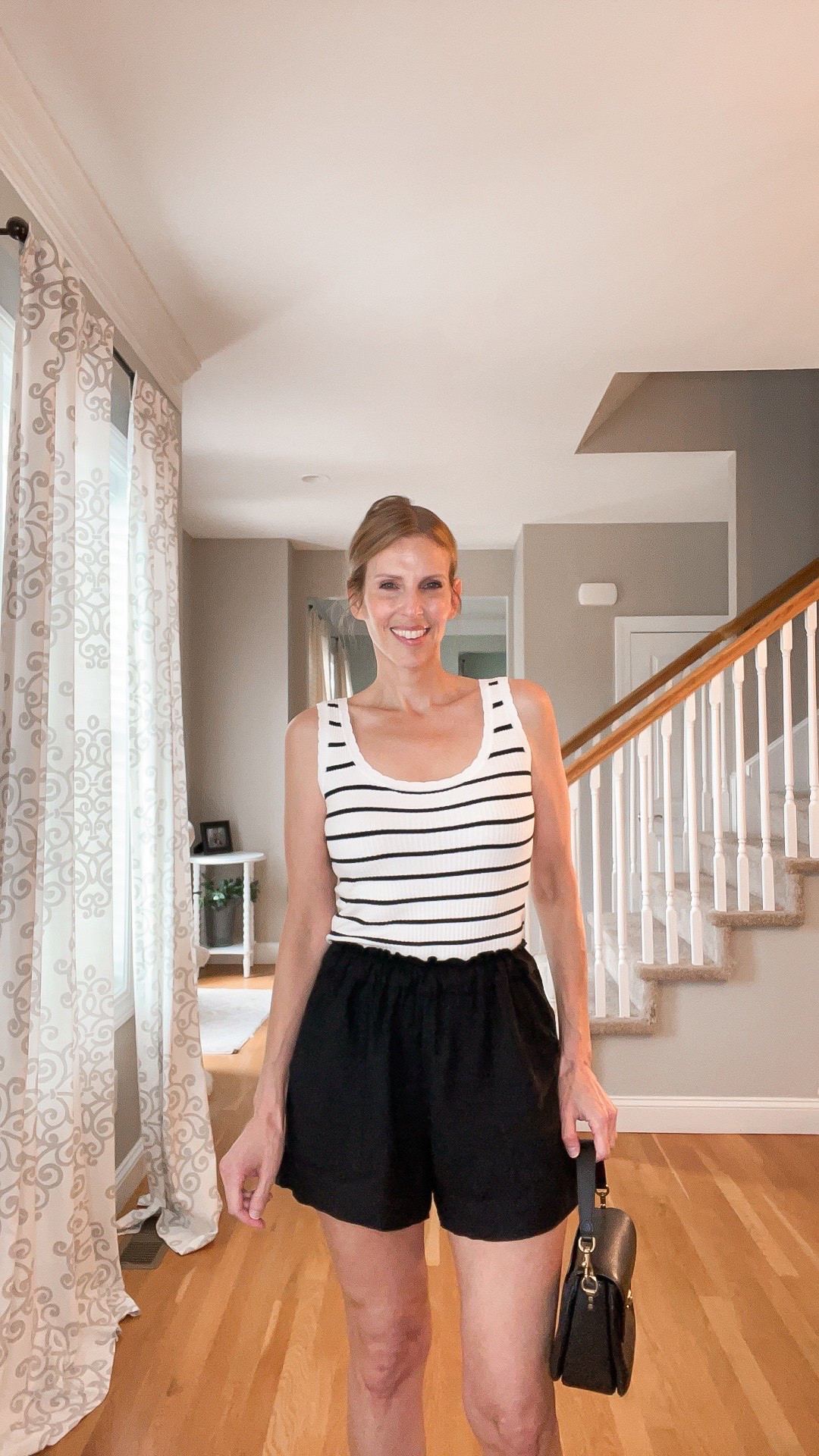 🤍🖤 Classic summer staples

Striped tank, black shorts, and slide sandals for an effortless everyday look. ☀️✨

#LTKOver40 #LTKSeasonal