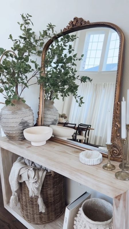 neutral entryway details ✨

I originally had gotten this mirror months ago and on sale for my fireplace mantle but ran into issues with trying to hang it and my mantle doesn’t meet the requirements for leaning it so here we are 👀 annnnd I’m IN loveeee with it here!! Ahhh 😌 

anywho, there’s five Target finds in this spot:
+ basket: older one no longer sold but linked some similar options
+ scalloped marble tray: I’m obsessed with it and looks cute on a nightstand or for a bathroom too
+ candle holders: older set but they have a newer one in the same color tone
+ pedestal bowl: reminds me of a pottery barn one but for less
+ blanket: hearth and hand and used it in my guest bedroom too! Love the cute tassels on it!

everything here will be linked in my bio! What do you think of this setup?

#LTKunder50 #LTKhome #LTKFind