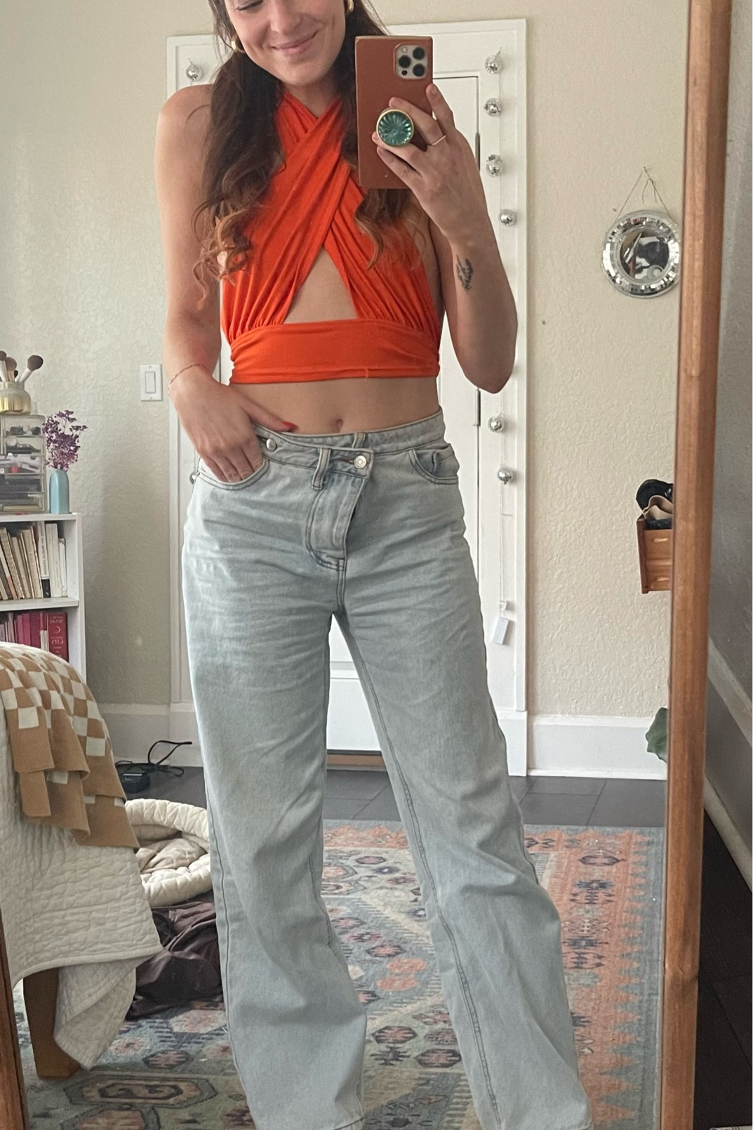 Bright orange criss cross crop top with cross waist baggy jeans for a spring day out! 

#LTKFindsUnder100 #LTKStyleTip #LTKFindsUnder50