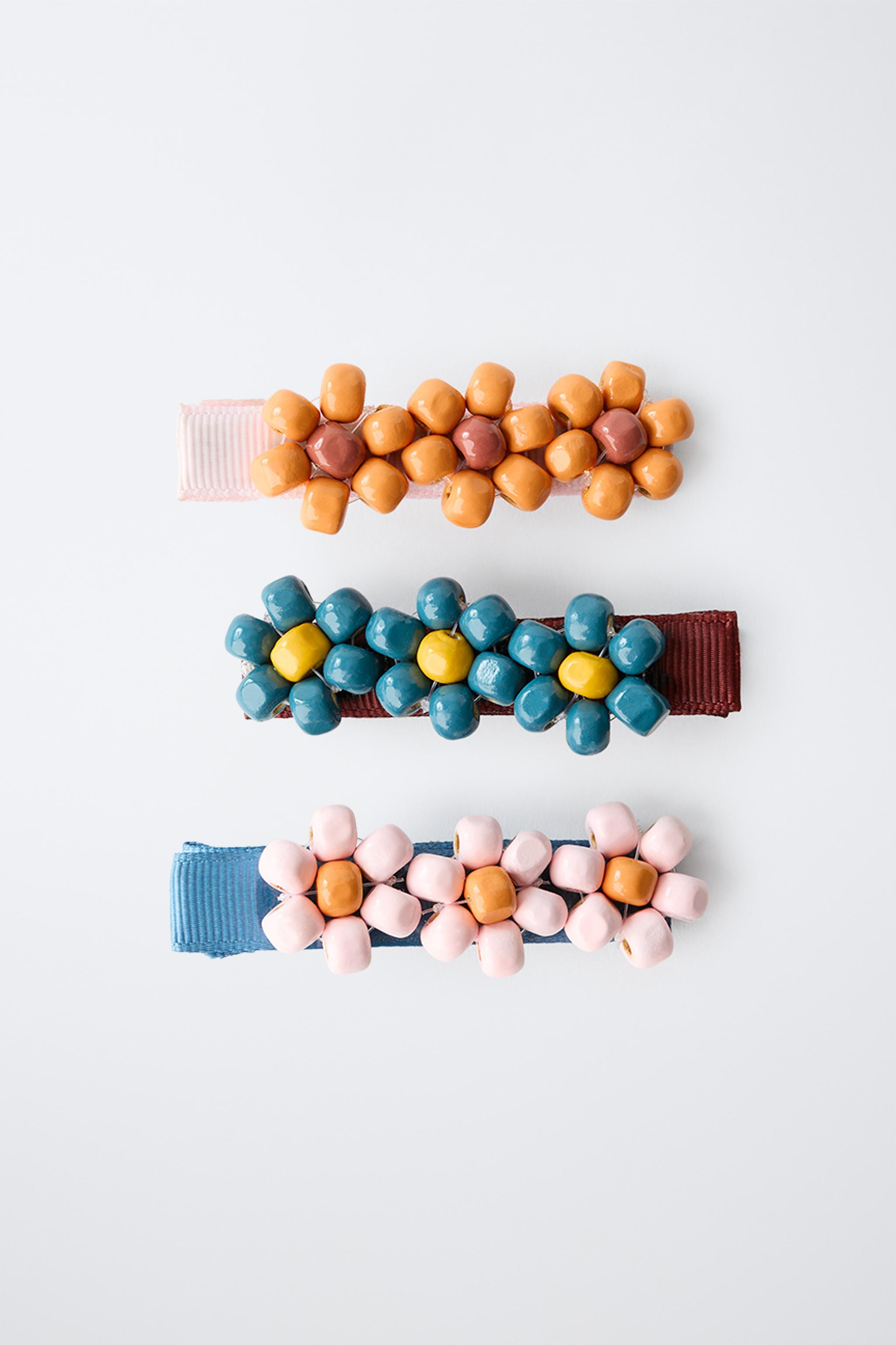Pack of three barrette-style hair clips featuring floral appliqu\u00e9s. Warning: contains small ... | Zara US