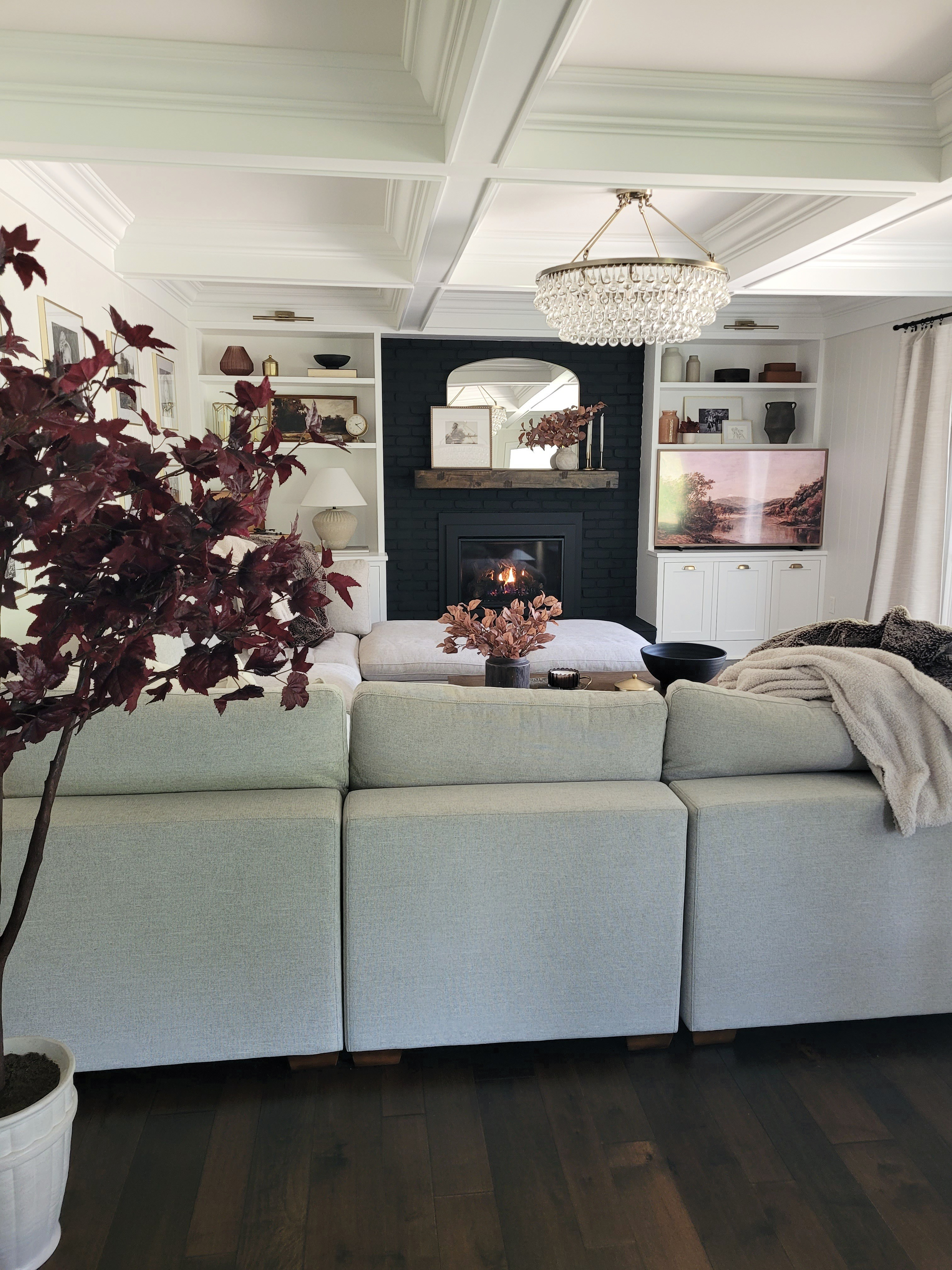 It's fall and I can't be convinced otherwise. Get your living room or family room ready for fall with this gorgeous artificial fall tree, fall stems,  and frame tv fall art! Built in styling,  shelf styling,  black fireplace

#LTKHome #LTKSeasonal