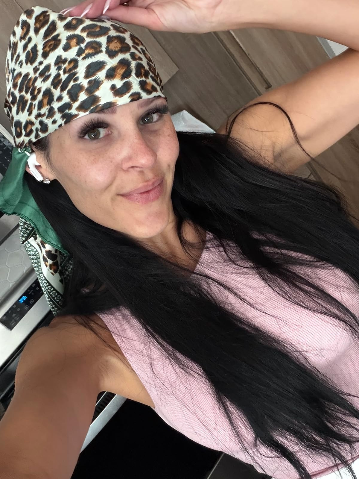 Obsessed with this effortless look! Styling a bold leopard print silk head scarf with a simple pink tank is the ultimate way to elevate your casual, everyday look. Save this post and click the link in my bio to shop the exact accessories! #LTKaccessories #LeopardPrint #HairAccessories 

 #LTKdayinmylife #LTKgrwm #LTKootd