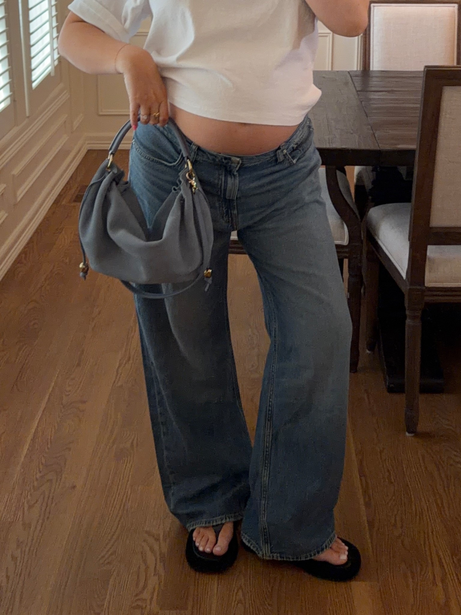 Size XS in tee it runs really loose and oversized so I went down a bunch! Anine Bing bucket hat love the stripes. Flip flops true to size and really comfy. Adorable blue suede bag from Madewell! Madewell jeans are so good they have a stretchy rigid denim fit so flattering. I’m 20+ weeks and size 31 up two from my usual size but they have lots of room. Size down I think one size for a more accurate fit! 

#springstyle #lowrisejeans #madewell #aninebing #pregnancystyle #pregnant 