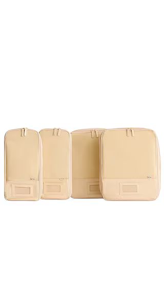4 Piece Compression Packing Cubes in Beige | Revolve Clothing (Global)