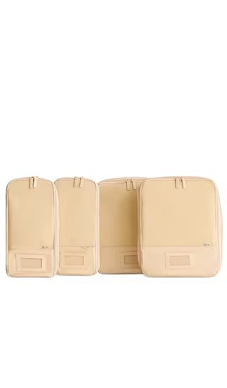 The Compression Packing Cubes 4pc in Beige | Revolve Clothing (Global)