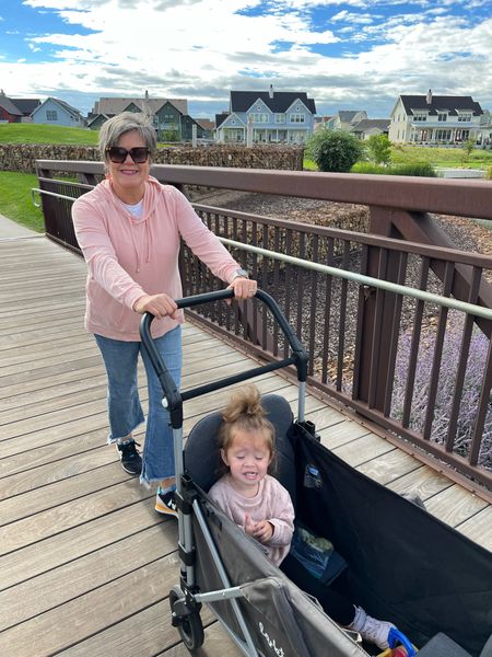 Enjoy a morning walk with grandkids. Excellent wagon for hauling kids and stuff to the game! Casual jeans and sweatshirt for gma and comfy New balance sneaks! 

#LTKkids #LTKfamily #LTKbaby