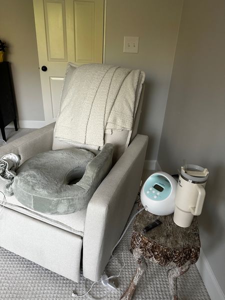 The perfect set up for nursing and pumping. The glider is a power recliner (great for c section moms especially) and has a built in charger for your phone. The breastfeeding pillow makes feeds much more comfortable and a cordless pump is a game changer. 

#LTKbaby #LTKbump #LTKhome