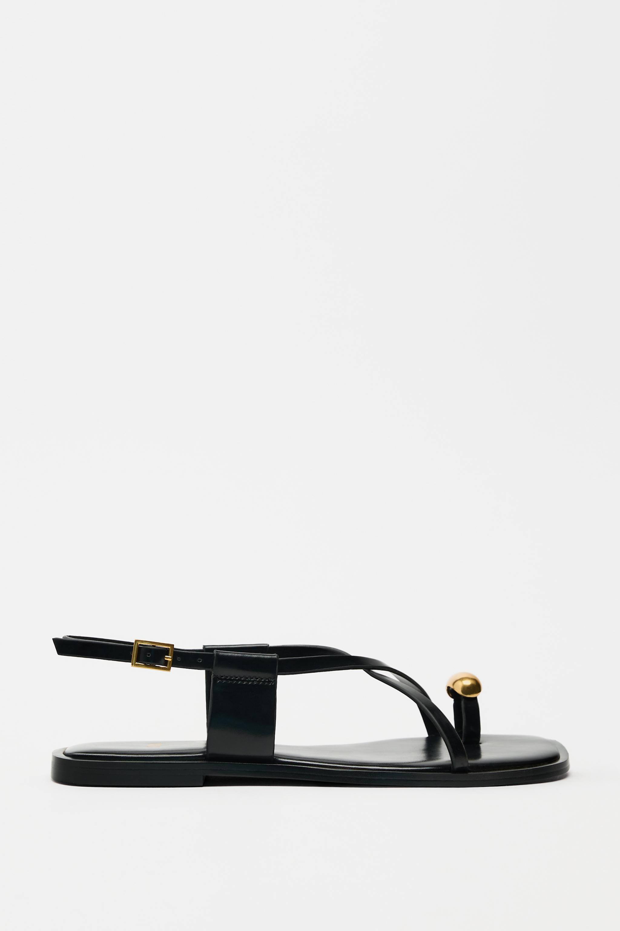Flat sandals with thin straps and a metal adornment on the toe. Buckle fastening.Sole height: 1.5... | Zara US