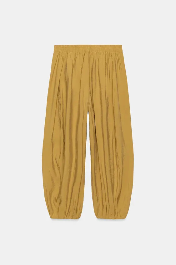 Mid-waist trousers with an elasticated waistband. Featuring front pockets and voluminous legs fin... | Zara FR