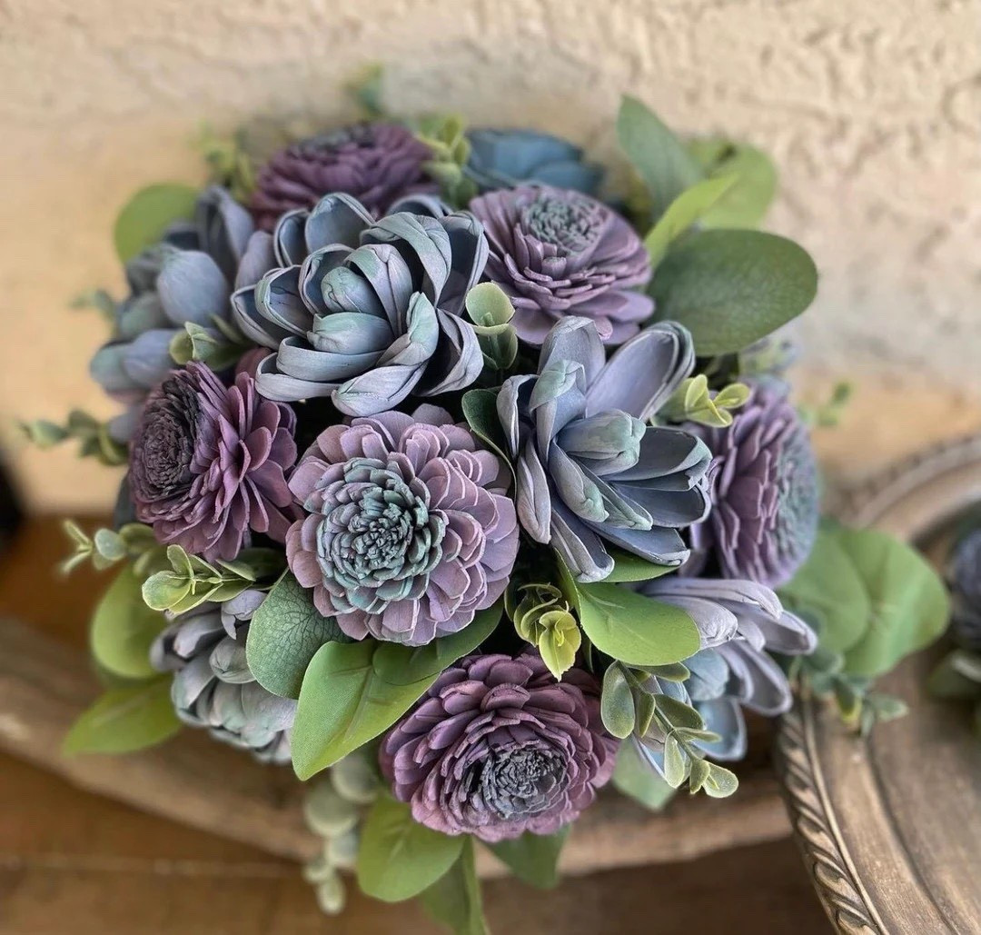 Timeless, romantic, and thoughtfully crafted, this handcrafted sola wood bridal bouquet by ForeverFlowersbyGigi is designed to be cherished long after your wedding day. Featuring hand-painted and dip-dyed balsa wood blooms paired with delicate filler flowers and lush greenery, it offers the beauty of fresh florals with none of the wilting. The burlap-wrapped handle adds a rustic touch, while custom color matching (including Behr paint shades) ensures it perfectly complements your vision. Lightweight, allergy-friendly, and available in multiple sizes and styles—including cascade—this bouquet is a stunning forever keepsake for brides who want beauty that lasts.

#LTKWedding #SolaWoodFlowers #EcoFriendlyBride #RusticWedding #BridalBouquet #WeddingInspo #AllergyFriendly #EtsyWedding

#LTKSeasonal #LTKWedding #LTKHome