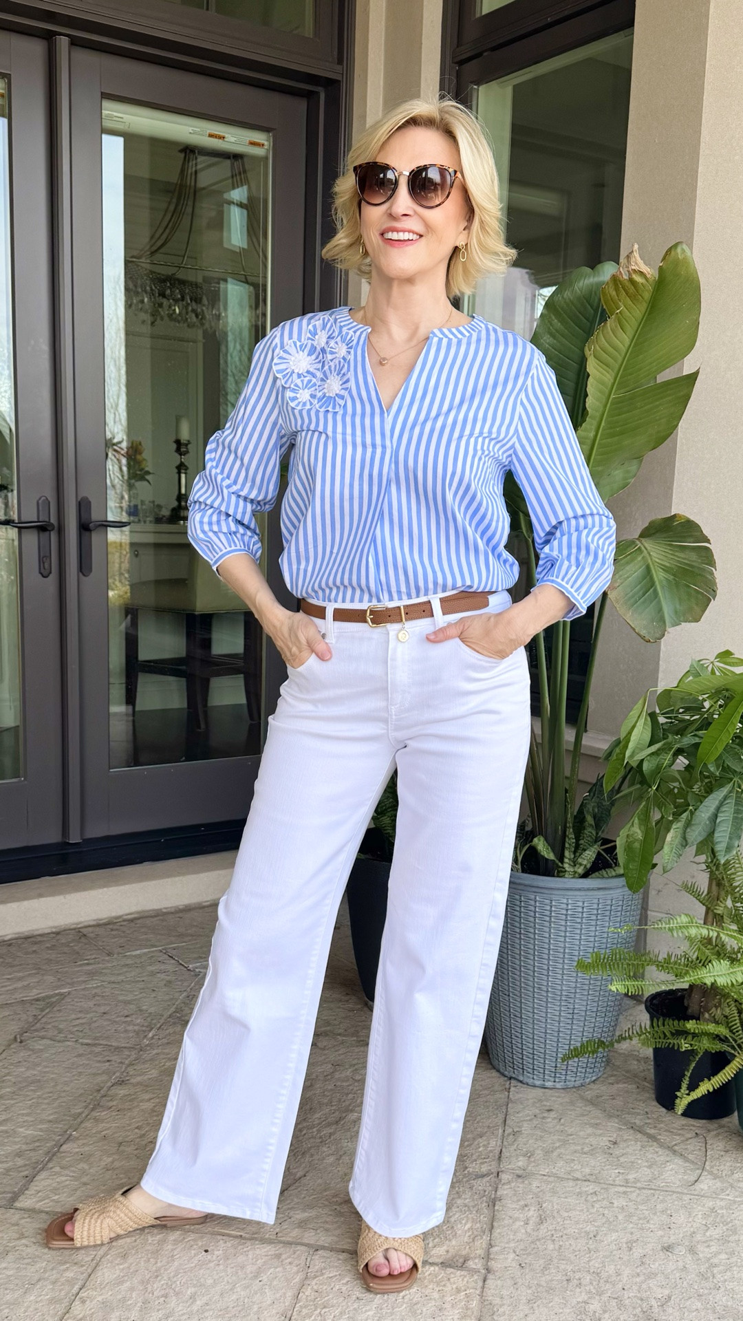 There’s something so effortlessly fresh about a classic blue stripe and crisp white trousers 🤍💙

This Talbots look feels like the perfect balance of polished and relaxed — the striped blouse keeps things light and timeless, while the white wide-leg pants add that clean, easy elegance I always gravitate toward. It’s the kind of outfit that works just as well for a lunch out as it does for a casual day where you still want to feel “put together.”

And can we talk about how good simple styling is here? Tucked in, a slim belt, and woven sandals — nothing overthought, just easy pieces doing what they do best.

Style tip I always come back to: when you’re wearing a crisp palette like blue and white, lean into natural textures (like raffia or leather) to keep everything feeling soft and grounded.

#LTKOver40 #LTKSeasonal #LTKootd