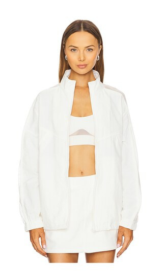 alo Origin Full-Zip Track Jacket in Ivory. Size L. Also in M, S. | Revolve Clothing (Global)