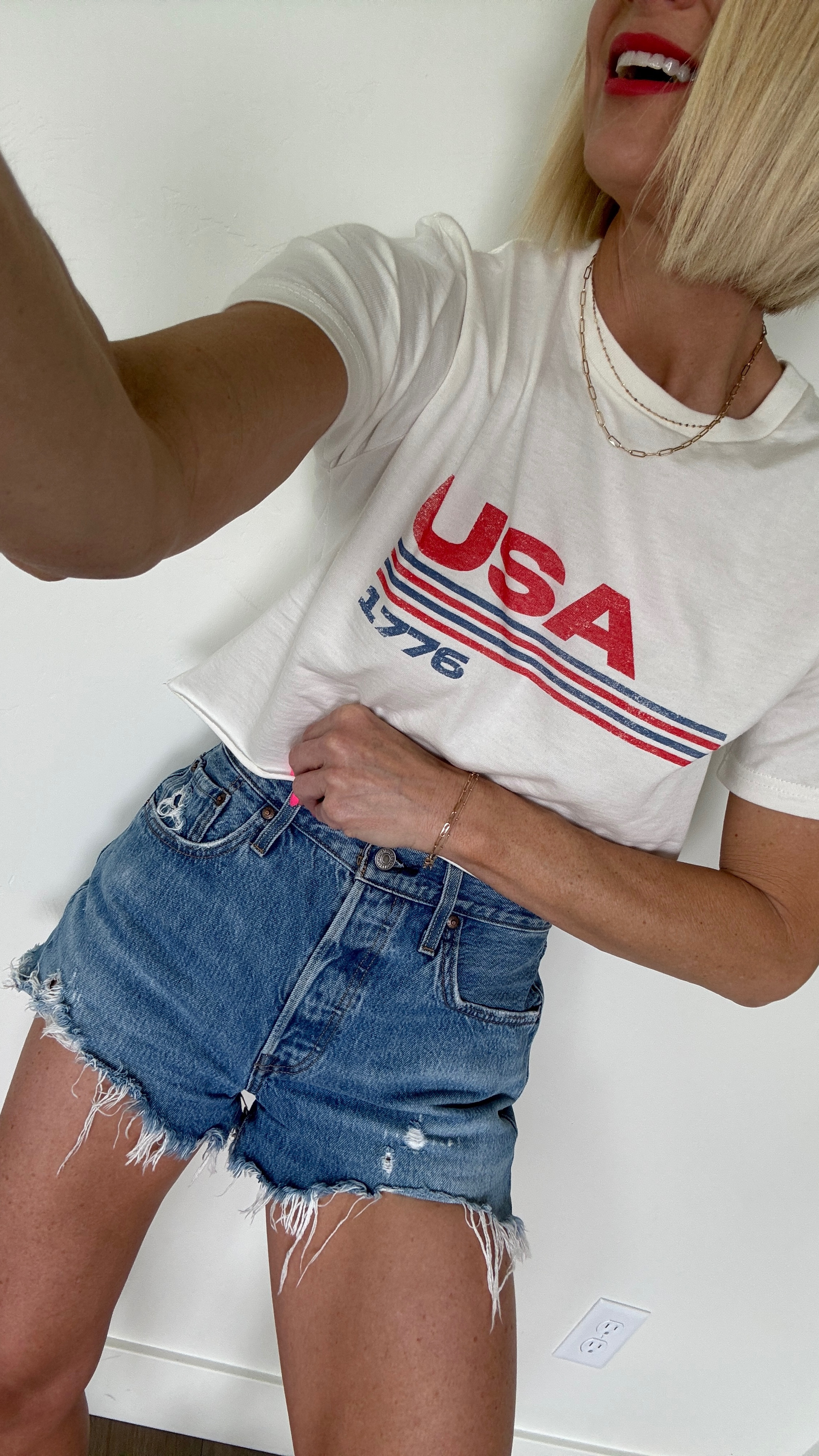 It’s Red, white and blue season!
I love an easy tee + cut off
jean shorts for summertime.🇺🇸
cutting a t-shirt is the easiest DIY you’ll ever do!😉 plus, there’s nothing worse than an awkward length shirt that’s too long to wear untucked, and we’re definitely not fully tucking it in. 
I turn it inside out, mark the length I like with a highlighter or washable marker every couple inches cross the shirt, then slowly cut! (The hem will slightly roll up, so keep that in mind)
perfect causal summer outfit for Memorial Day weekend or July 4th outfit.
🚨For the USA T-shirt, Use code: BETHANYSAVE30 for 30% off your purchase!
be sure and size up ⬆️ in shorts. T shirt fits tts (it’s really long!)
🪩go 1/2 size down from normal shoe size in sneakers— sizes are selling fast!

#LTKFindsUnder50 #LTKSeasonal #LTKParties