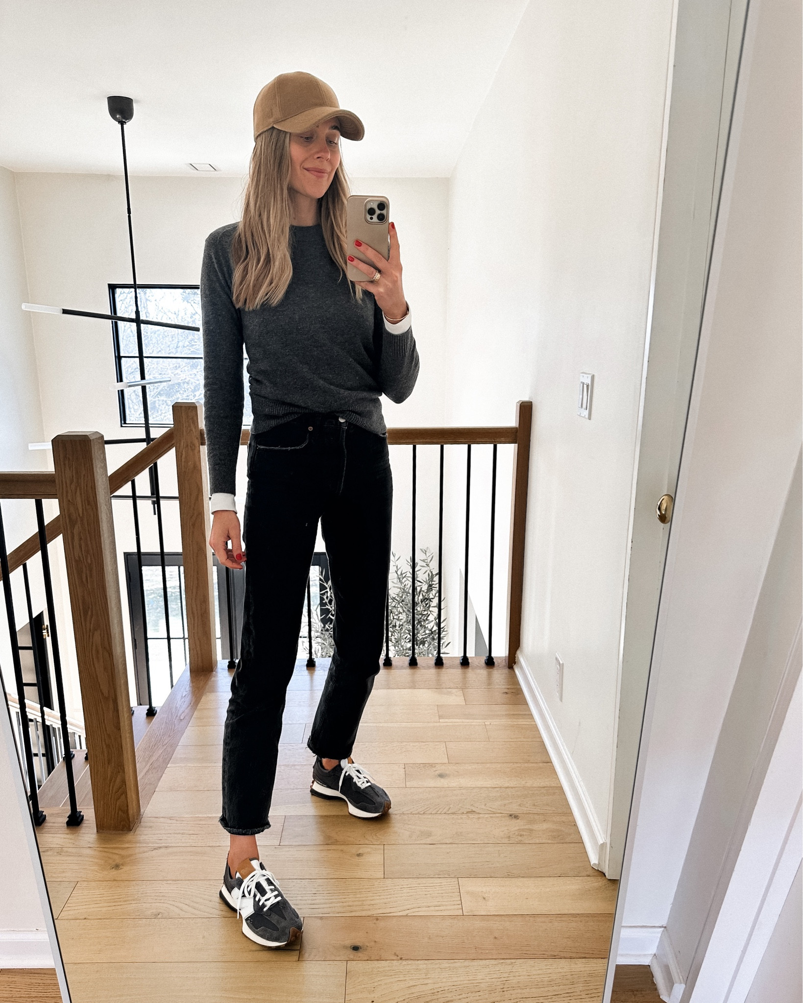 Fashion Jackson wearing grey sweater (small) white long sleeve tee (small) black AGOLDE jeans, new balance 327 sneakers, tan baseball hat, #fashionjackson #springoutfit #sneakers 

#LTKshoecrush #LTKstyletip #LTKunder100