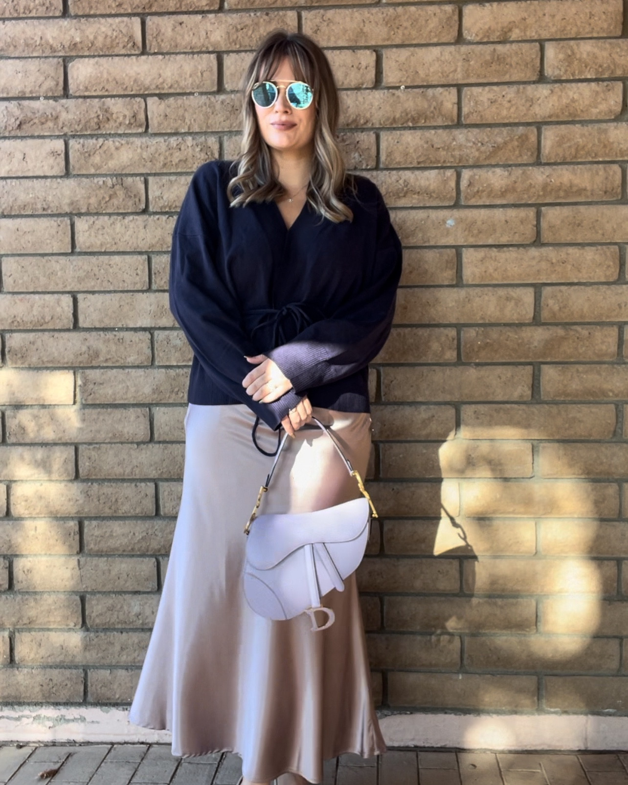 A satin skirt will never go out of style. 
This satin skirt is double lined, hiding any imperfections you may have. The cardigan can be worn both open or closed like I have it here. It’s very soft, warm, and comfortable. 

#LTKFindsUnder100 #LTKStyleTip #LTKMidsize