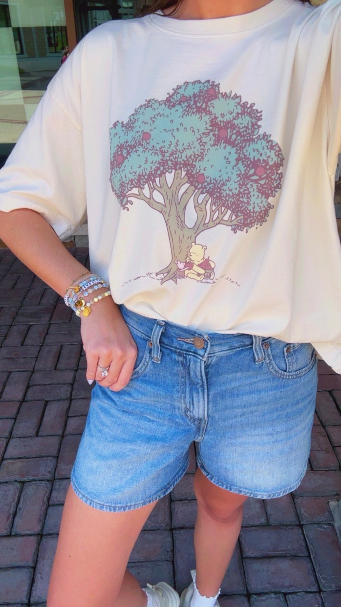 Winnie the Pooh ootd💛 Disney outfit, Disney bound, Disney style, Disney girl, Disney ideas, Disney Inspo, comfy outfit, spring outfit, summer outfit, Disney graphic tee, Albion fit cropped tshirt, Levi’s mid thigh cinched waist denim shorts, mom jean shorts, chunky Reebok sneakers, ruffle socks, Amazon sunglasses, Disney accessories, Disney jewelry, little words project #disney

#LTKTravel #LTKSeasonal #LTKootd