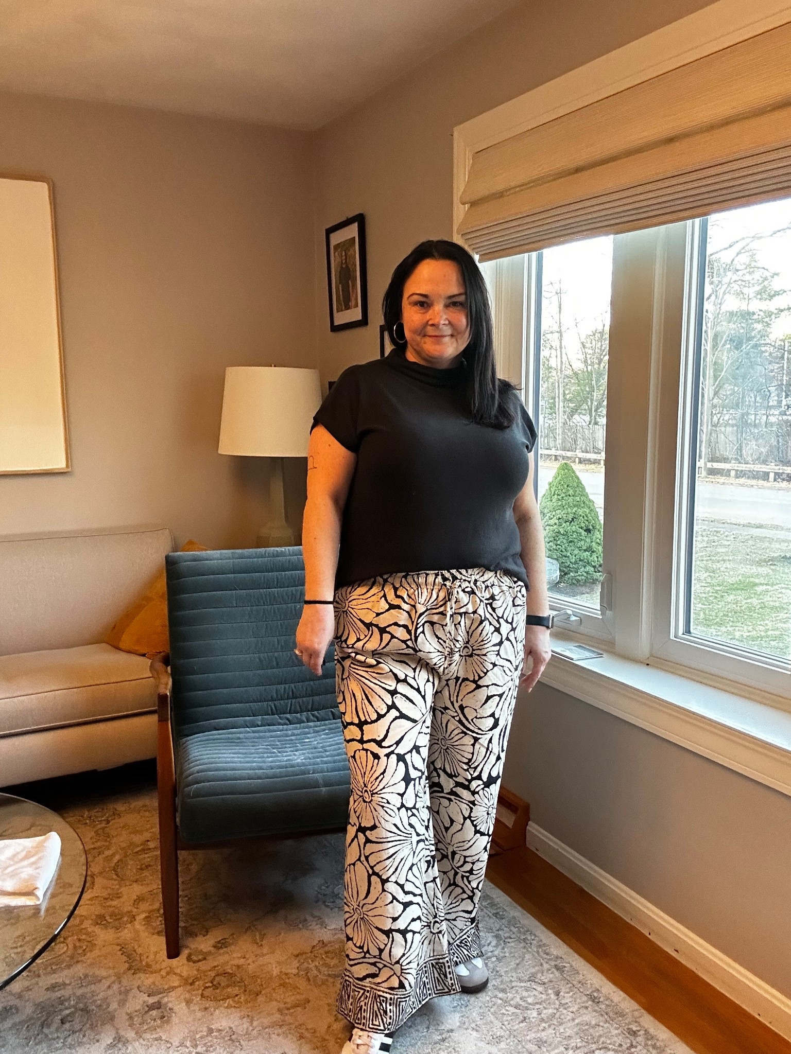 Casual midsize ootd with true to size printed wide leg pants and a black short sleeve top. This comfortable outfit is easy, flattering, and perfect for real life. The flowy statement pants are lightweight and breathable with a relaxed fit, paired with a simple black top that makes this outfit feel effortless but put together. A go-to everyday outfit formula for midsize women.

#LTKootd #LTKWorkwear #LTKMidsize