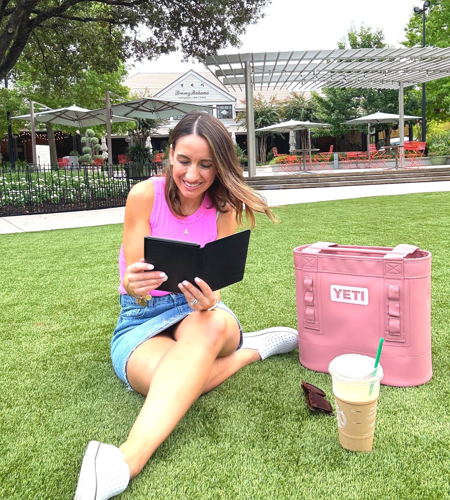 Hanging out with my kindle. 
Pink tank top. Denim skirt, comfy casual white shoes. 
Yeti Camino 20 in Sandstone. 
I love this bag  

#LTKFindsUnder50 #LTKFindsUnder100 #LTKPetite