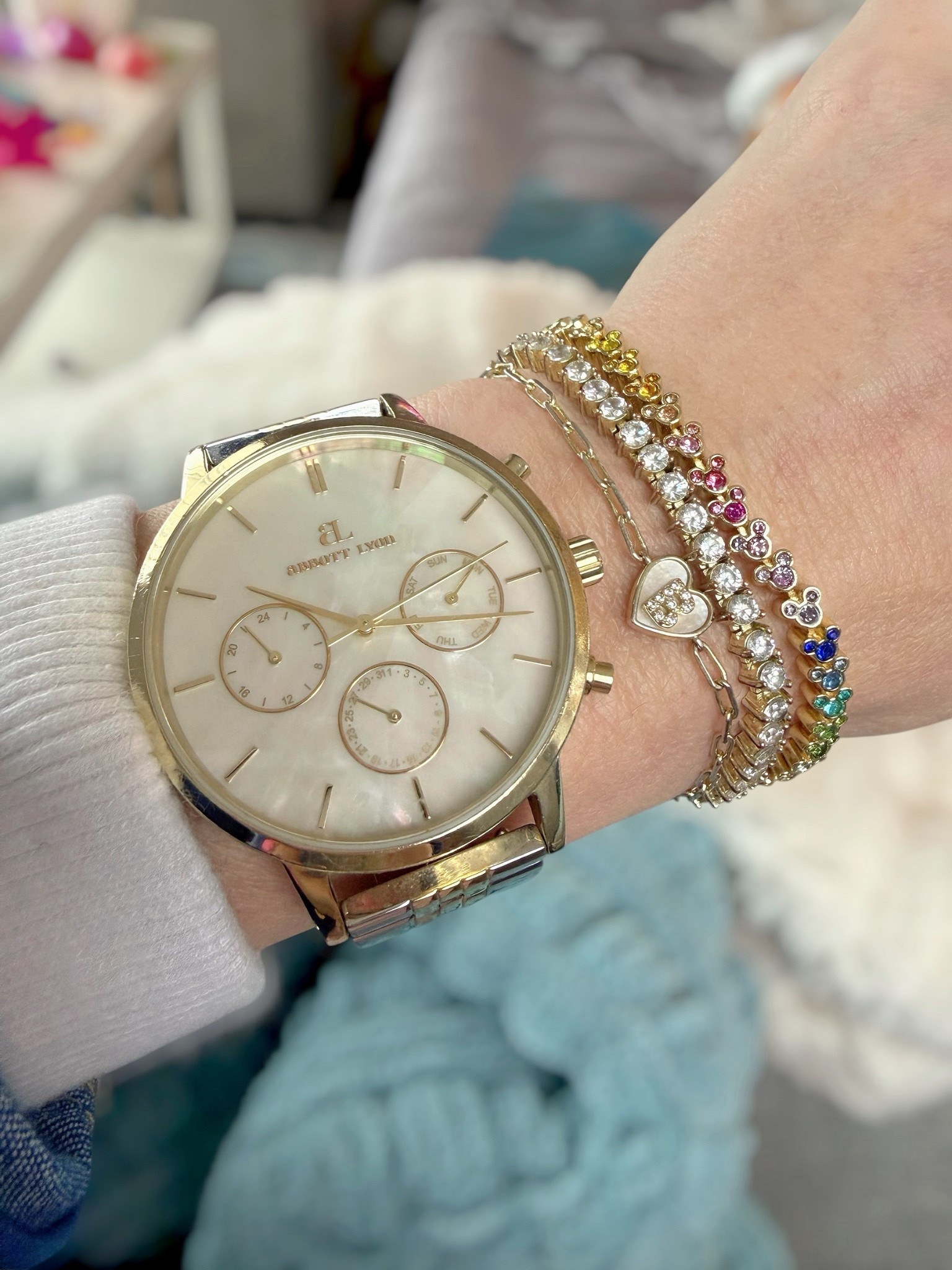 Stacked Gold Jewelry + Everyday Watch Look ✨

Obsessed with this dainty gold wrist stack lately 💛✨ layering a classic pearl face watch with mixed bracelets for the perfect everyday sparkle. The colorful Mickey Mouse crystal tennis bracelet adds just the right pop 🌈 and I love pairing it with a simple heart detail and timeless gold pieces for that effortless, put-together vibe.

This combo is perfect for dressing up casual outfits or adding a little shine to your everyday look 💫 such an easy way to elevate even the simplest outfit!

gold jewelry stack, bracelet stack, dainty jewelry, everyday accessories, gold watch, colorful bracelet, preppy style, feminine accessories, classic style, layered jewelry look, Disney jewelry, Disney outfits 

#LTKmomlife #LTKdayinmylife #LTKTravel
