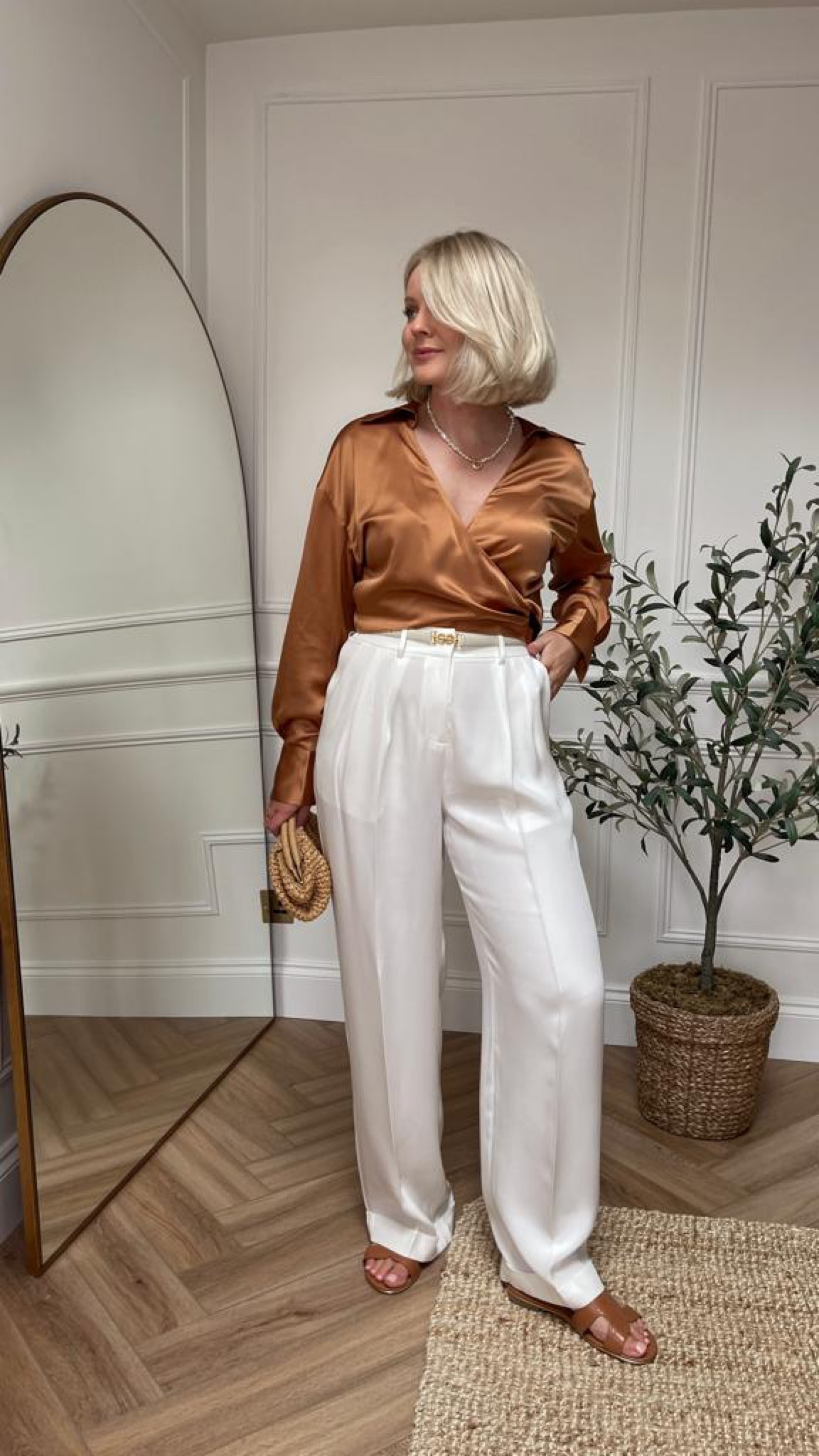 Transitional outfits - lilysilk caramel brown silk wrap cropped shirt, white silk tailored trousers & beige slim belt, dune tan sandals & Reiss raffia clutch bag  

#LTKeurope #LTKstyletip #LTKSeasonal