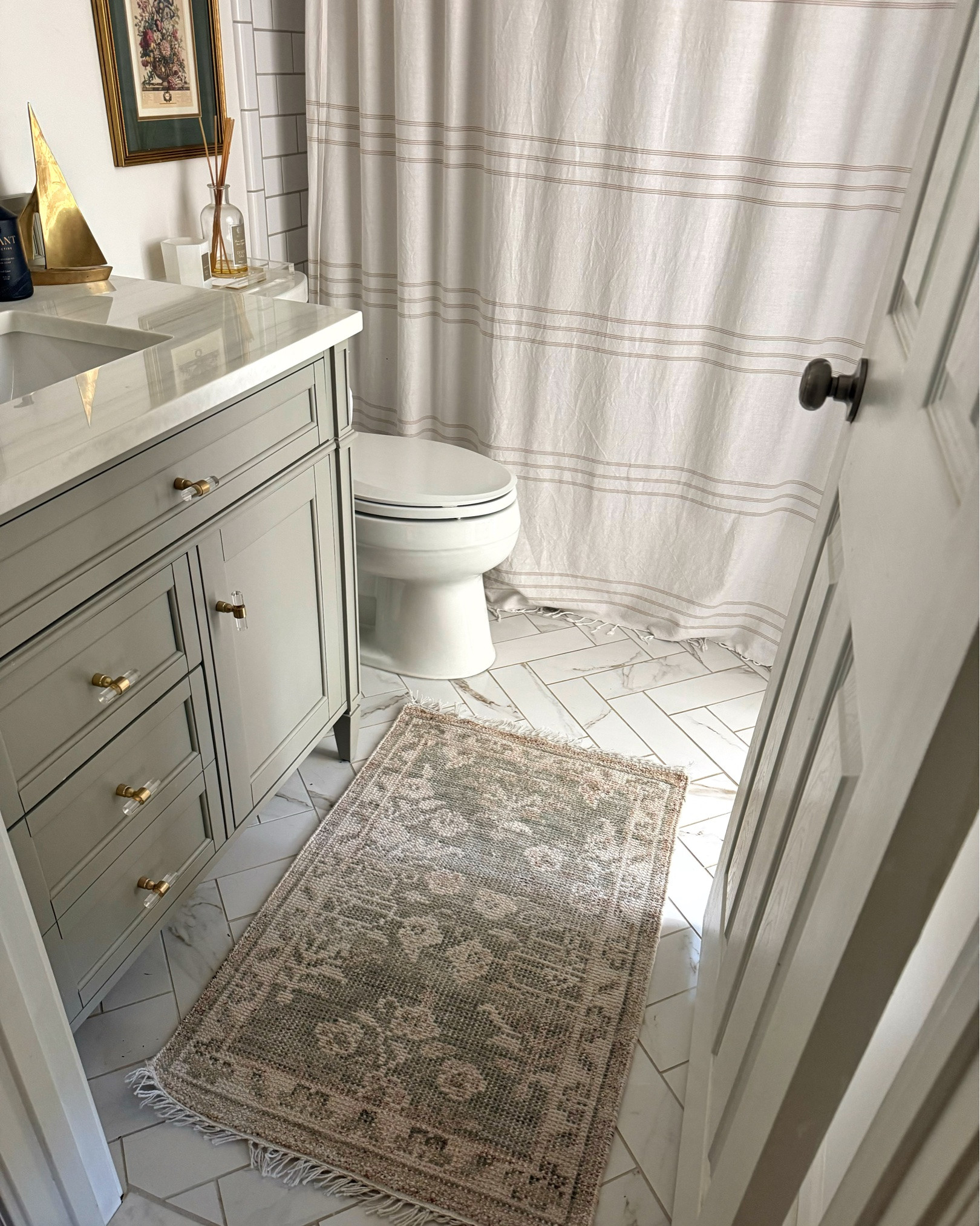 Wayfair does it again!  This hand knotted Turkish rug is GORGEOUS. Obsessed with the sage green color and beautiful pattern.  As you can see, the color varies depending on how much light your space receives.