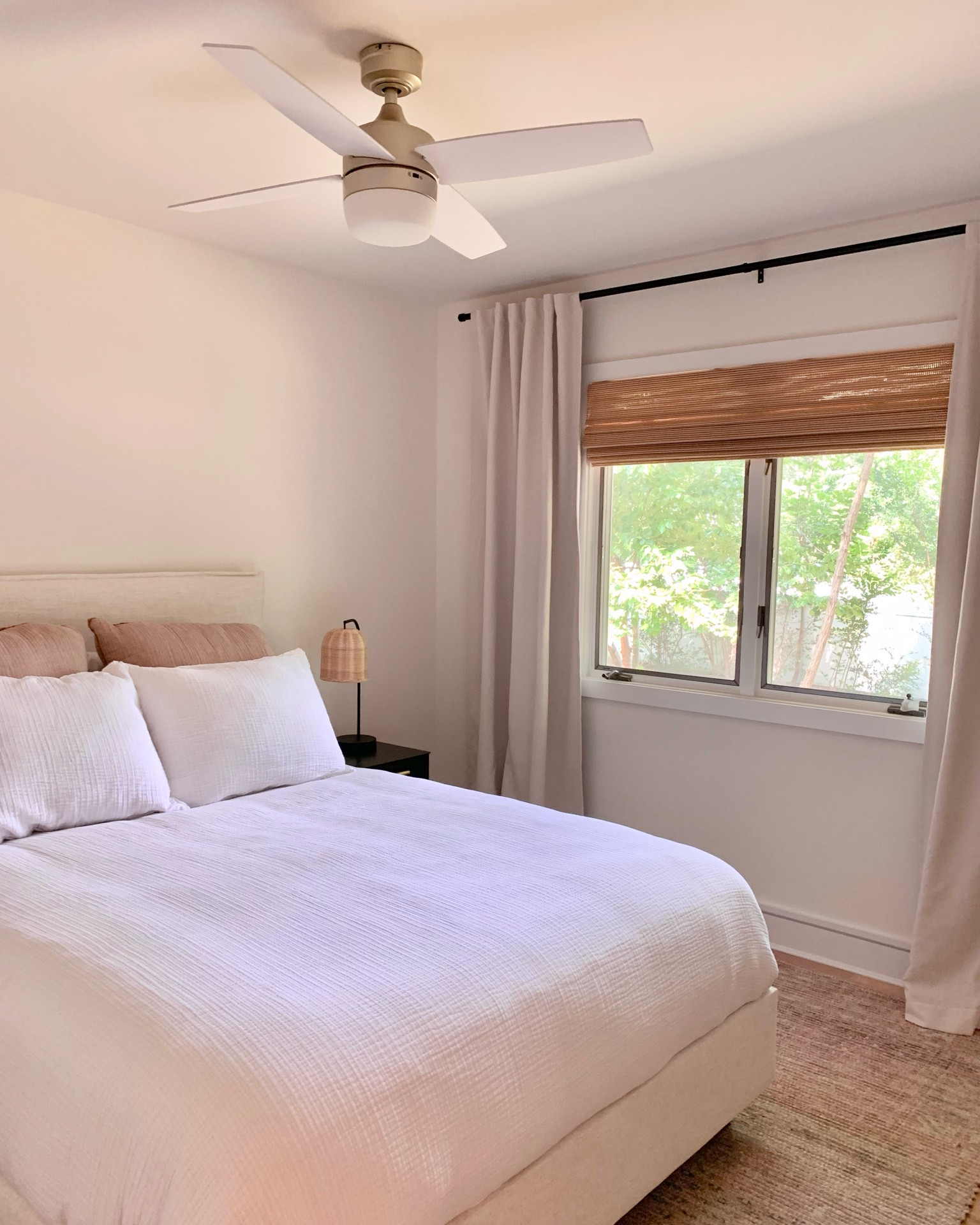 Bedroom is coming together! Love these natural looking bamboo blinds and curtains against the black rod! Neutral tan and white color pallete with a warm tone rug. Champagne gold modern ceiling fan. 

White duvet down comforter 
Rattan woven wicker table lamp
Jute wool chenille rug
Cabin
Chalet
Beach house
Mid-century modern
Bedding
Throw pillows
Target
Home Depot 
Woven wood shades
Walmart finds
West Elm

#LTKunder100 #LTKunder50 

#LTKhome