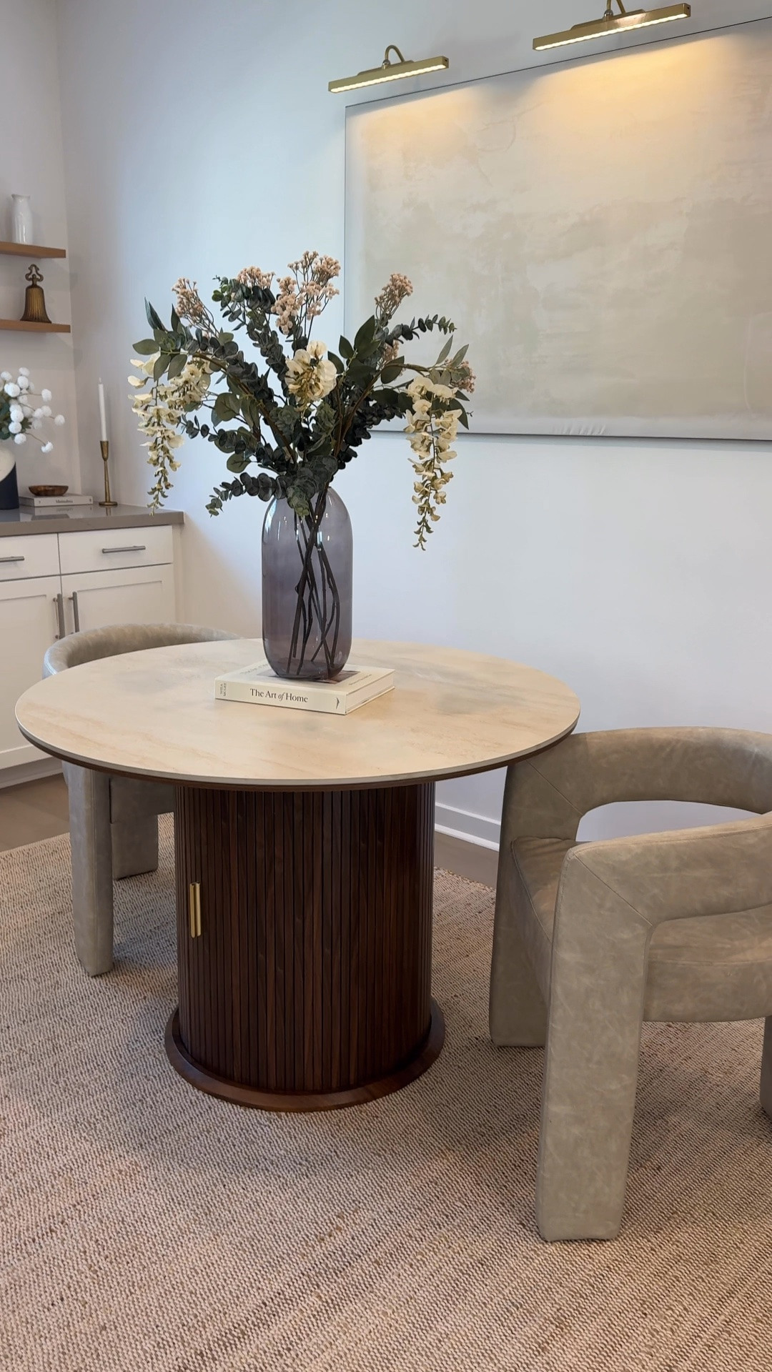 the perfect stone table does exist🤩

If you're looking for a dining table that's beautiful but can actually handle real life, you need to see this one.

I wanted something modern and elevated, but also practical enough for everyday meals, hosting friends, and all of life's little messes. This table checked every single box.

First, the tabletop is made from sintered stone, which means it's incredibly durable. It's heat-resistant, scratch-resistant, and stain-resistant—which, honestly, is a must in my home. I don't have to stress about hot dishes, spills, or everyday wear and tear, and it still maintains that beautiful high-end look.

One of my favorite features is the hidden storage. It has built-in shelves that are adjustable and removable, so you can customize the space however you need. I love being able to keep extra dishes, table linens, and entertaining essentials tucked away but still easily accessible.

The slatted sliding doors add such a beautiful designer touch. The groove texture gives it a clean, modern, and premium feel that instantly elevates the entire room. It honestly looks like something you would see in a luxury home.

It also comes in two sizes—43-inch and 55-inch—and in both Walnut and Black finishes, so it's easy to find the perfect fit for your space. This piece completely transformed my dining area, and I love that it's both functional and beautiful. If you've been searching for a statement piece that can actually keep up with everyday life, this is definitely one to check out!

#diningtable #diningroom #diningroomtable #stonetable #neutralhomedecor #homedecor #woodtable