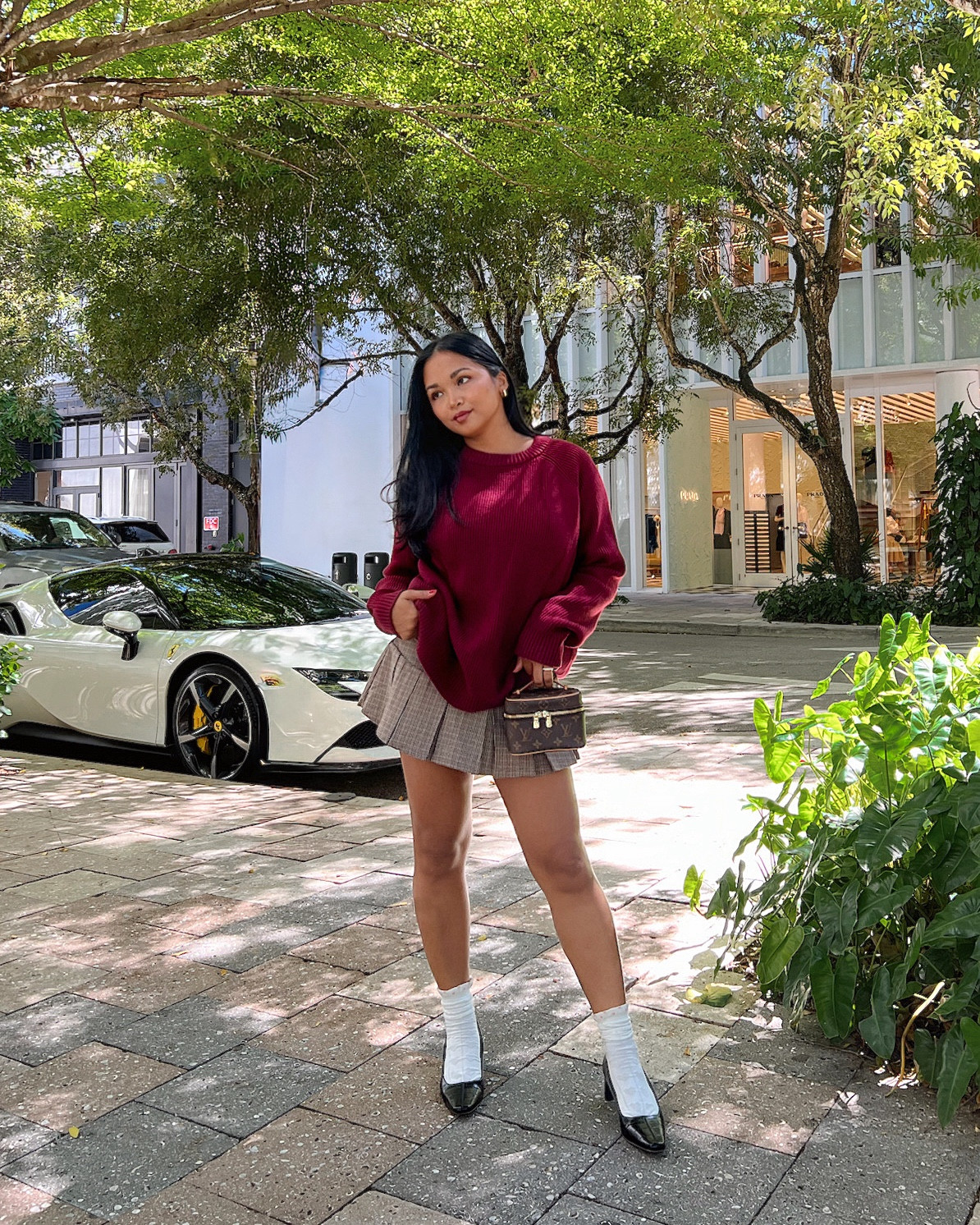 Preppy fall girl style: oversized burgundy sweater + brown pleated mini skirt (skort). Wearing a size medium in sweater for an oversized fit, and small in the skirt. #falloutfitinspo 

#LTKSaleAlert #LTKFindsUnder50 #LTKSeasonal