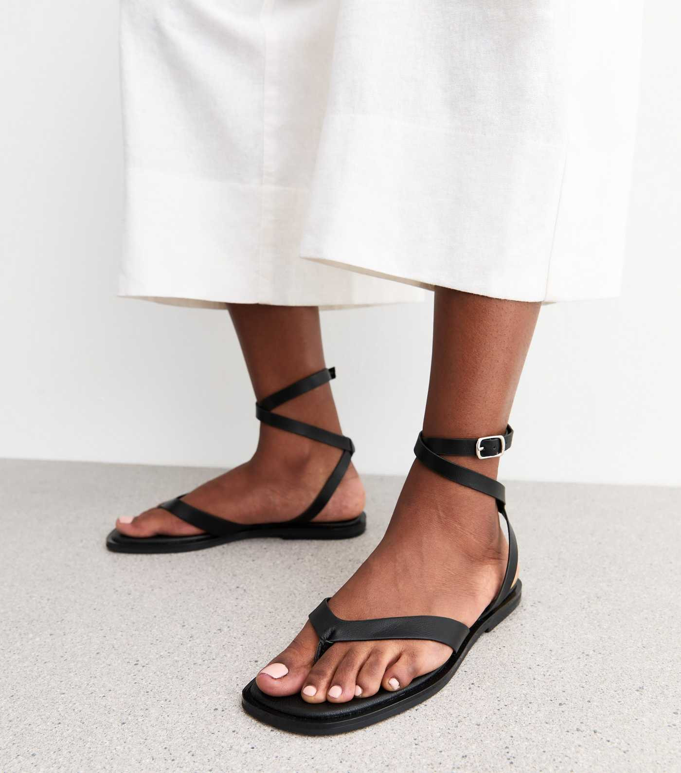Black Faux Leather Thong Strap Ankle Wrap Flat Sandals | New Look | New Look (UK)