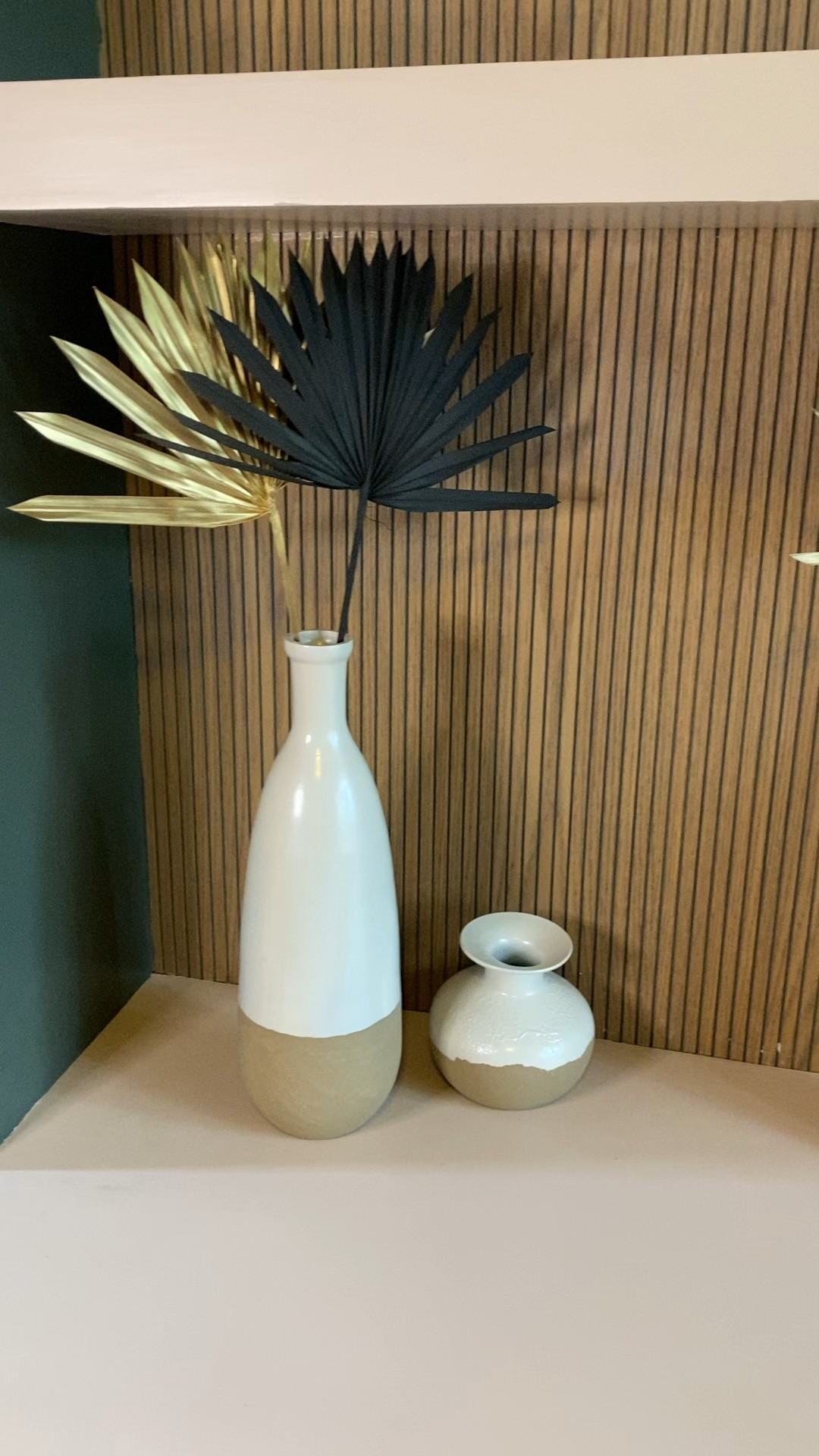 West Elm dipped vases or thrifted DIY dupe! 
Scuff sand, prime and tape then spray texture to the lower portion. Get a sample jar of Behr paint in the color “PureEarth” in a matte finish and mix it with baking soda to give it more texture and brushed it on. Then spray paint the top portion with Behr Hammered White Gloss. 

#LTKGiftGuide #LTKfindsunder50 #LTKhome