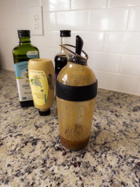 As I’ve been on my own wellness journey, one of my favorite things to do in the kitchen is find new recipes for creating my own salad dressings at home. And it’s actually really easy and not time consuming at all. I’d encourage you to give it a try! 🥗

This salad dressing storage container has metrics on it in (cups, oz, and mL) making it very easy for me to measure as I make - and I love that! Once I pour the amount I want on my salad, I just close the black piece on top and stick this in the fridge for the next day. So many great uses and this adds value to my life! 🙌🏽

This homemade balsamic vinaigrette dressing has a combination of olive oil, balsamic vinegar, dijon mustard, honey, salt, & pepper! No weird or unnecessary ingredients or sugars added or needed. It was delicious and I could enjoy it guilt-free! 

Shop it here! 🫶🏽

Kitchen finds, home finds, containers, kitchen storage, food storage, salad dressing bottle, healthy, wellness, salads, cooking

#LTKFind #LTKunder50 #LTKhome