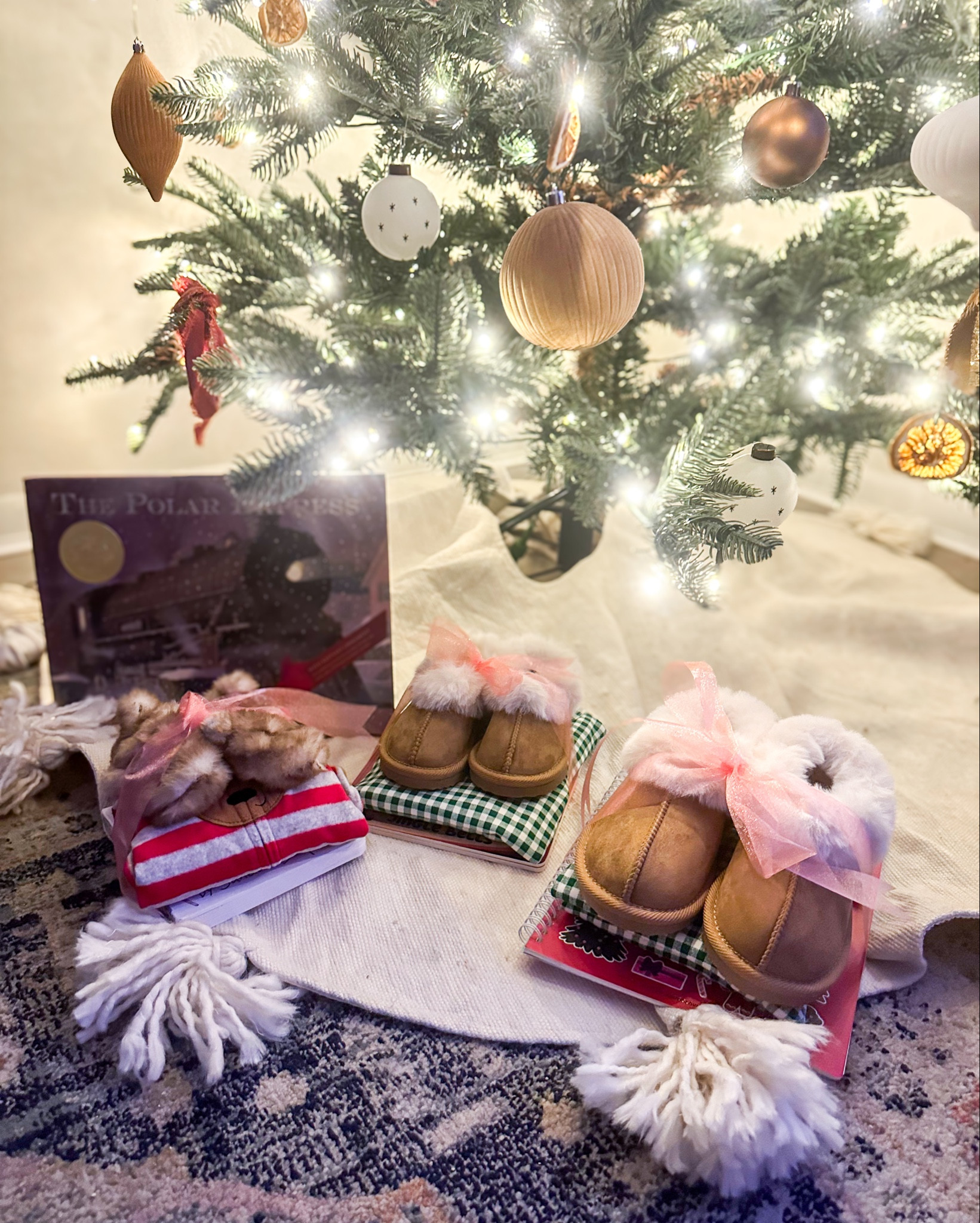 Cozy December gifts under the tree! My favorite tradition is to gift my kids, cozy Christmas PJs, and a holiday book to start off the season! 🎄

#LTKBaby #LTKHoliday #LTKKids