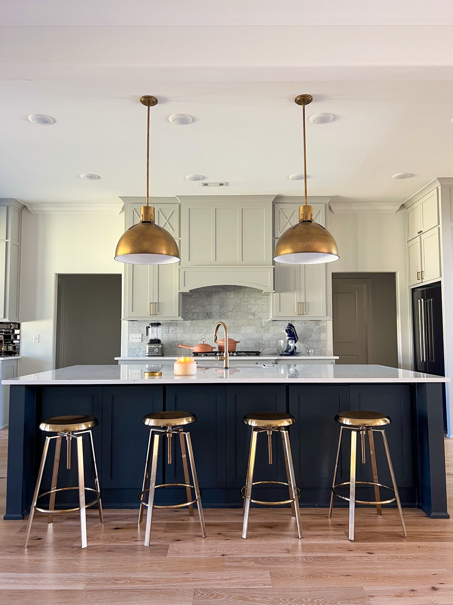Kitchen Island Vibes. I added warmth throughout my neutral kitchen pallet with gold fixtures and hardware. My kitchen island is over 9ft so I went with two of the larger pendants which I’ll tag here. 

Home design, kitchen, lighting, interiors, decor 

#LTKhome