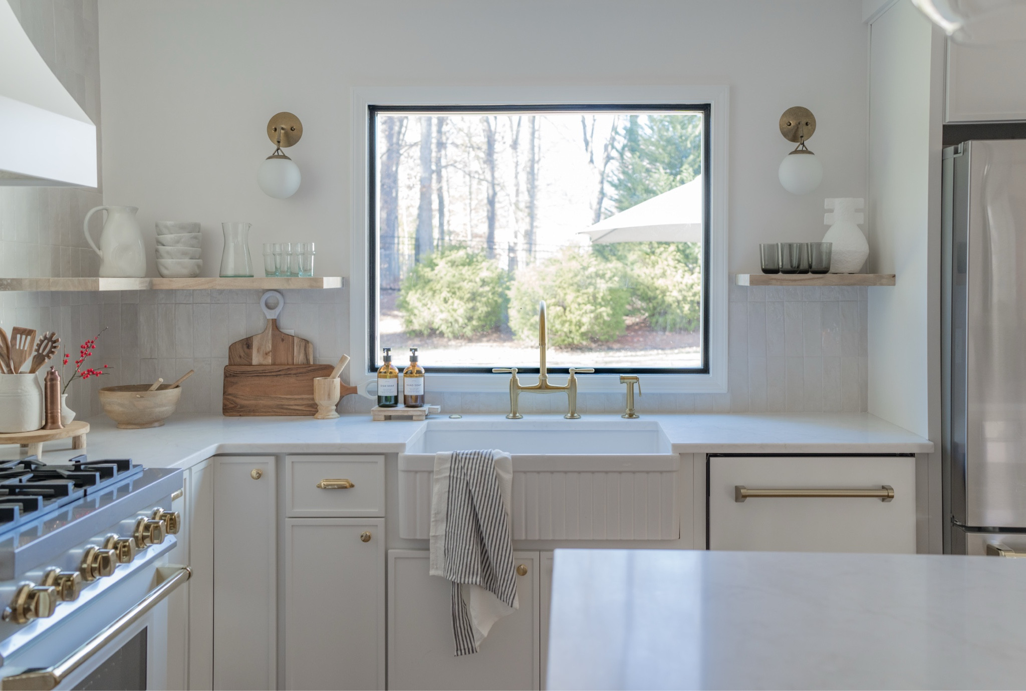 White kitchen, neutral, home renovation. Fluted sink, brass bridge faucet. #kitchendesign

#LTKHome