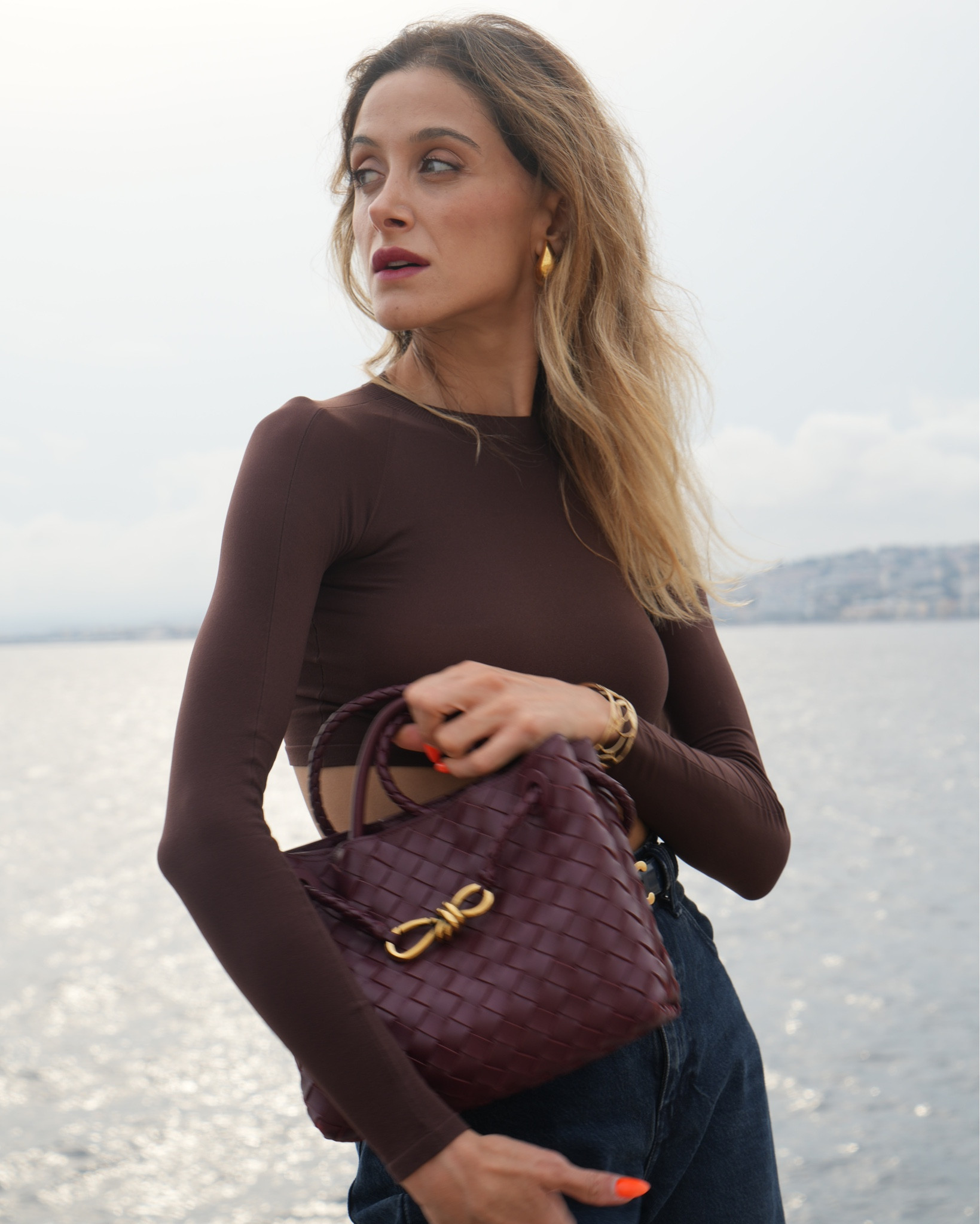 Fall denim, elevated: Alaïa chocolate long-sleeve crop, FRAME baggy jeans, Celine Triomphe belt, Saint Laurent purple pumps, and the Bottega Veneta Andiamo in burgundy. Clean lines, rich tones. 

Tap to shop the exact pieces + budget options.

Alaia crop top, Bottega Andiamo burgundy, FRAME baggy jeans, YSL purple pumps, Celine Triomphe belt, fall denim outfit, burgundy accessories, French Riviera style

#LTKstyle #LTKjeans #LTKautumn #Alaia #BottegaVeneta #SaintLaurent #Celine #FrenchRivieraStyle

#LTKautumn #LTKbag #LTKjeans