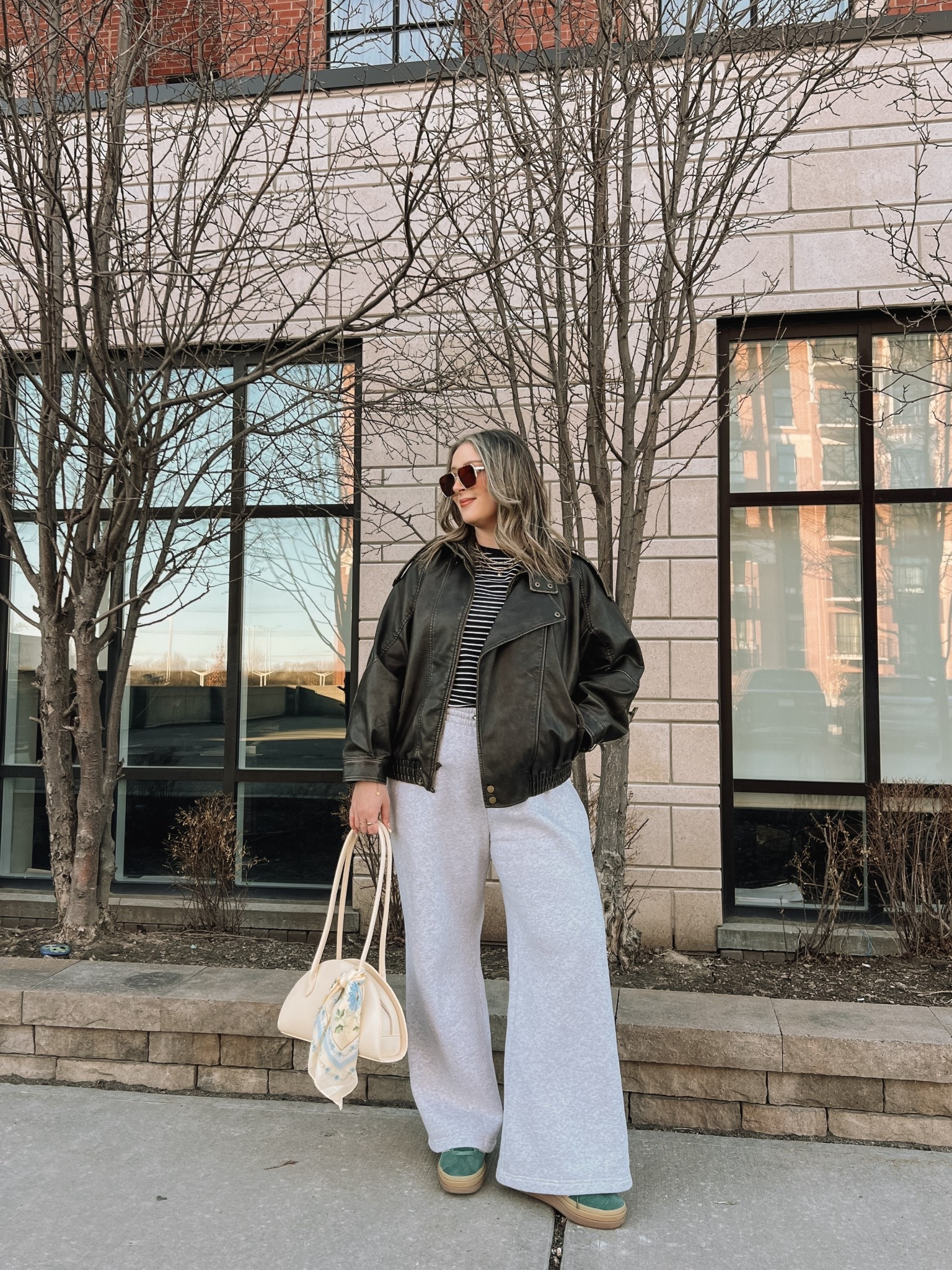 Comfy casual spring outfit! Wearing my usual size L in the wide leg sweatpants (I love the thick material of these!) and L in the leather jacket. Sized up to XL in the tee cause I have a larger chest. Bag and scarf are Old Navy, Canadian links under “similar products”. Adidas gazelle sneakers run a little big, I’m a 9.5-10 and wear a 9.

#LTKmidsize #LTKstyletip