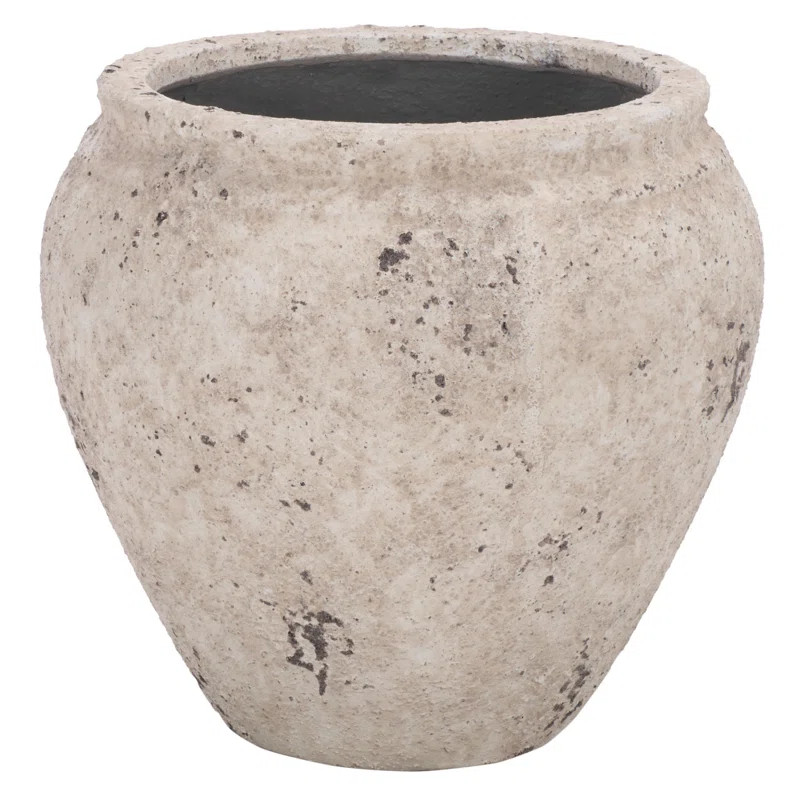 Transform your outdoor space with the Ramsey planter pot, a beautiful addition that merges style ... | Wayfair North America