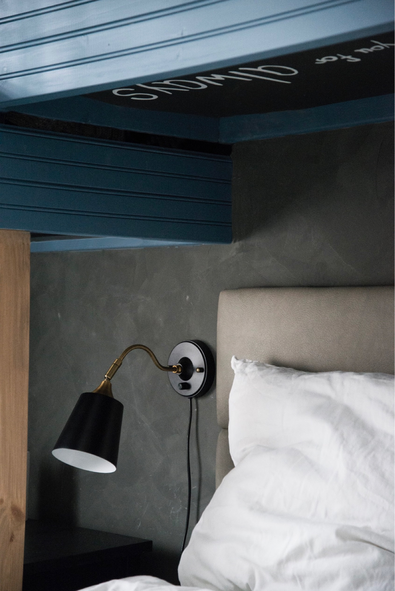 A new angle from my son’s room makeover. 

There is a faux Roman clay finish on the wall, black and brass plug in wall sconce, faux leather channel tufted headboard, white euro sham, 2 drawer black nightstand

#LTKhome #LTKFind #LTKkids