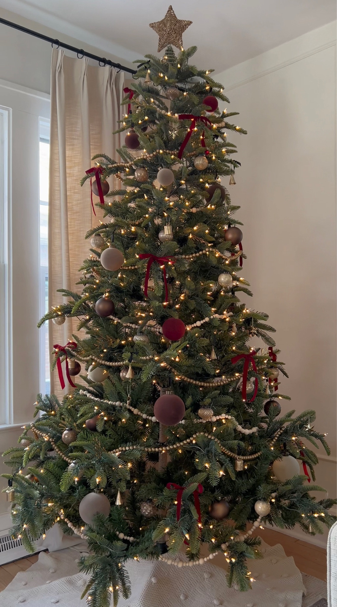 Christmas tree decorated with flocked velvet ornaments, velvet ribbon bows, brass bells, bead garland, etc. 

#LTKSeasonal #LTKhome #LTKHoliday