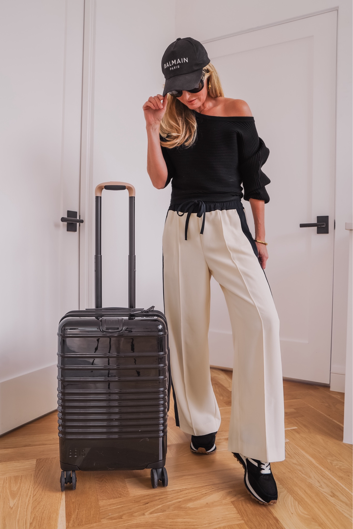 I love how cool and effortless, yet super comfortable this travel outfit is. Also, this BÉIS carry-on roller bag is AMAZING! It has so many incredible features, it’s 22” (the largest carry-on size I’ve found), and the glossy black color is super chic. It also comes in medium and large checked bag sizes. 

P.S. If you love organization as much as I do, the coordinating BÉIS packing cubes are a MUST! 

~Erin xo 

#LTKStyleTip #LTKTravel #LTKItBag